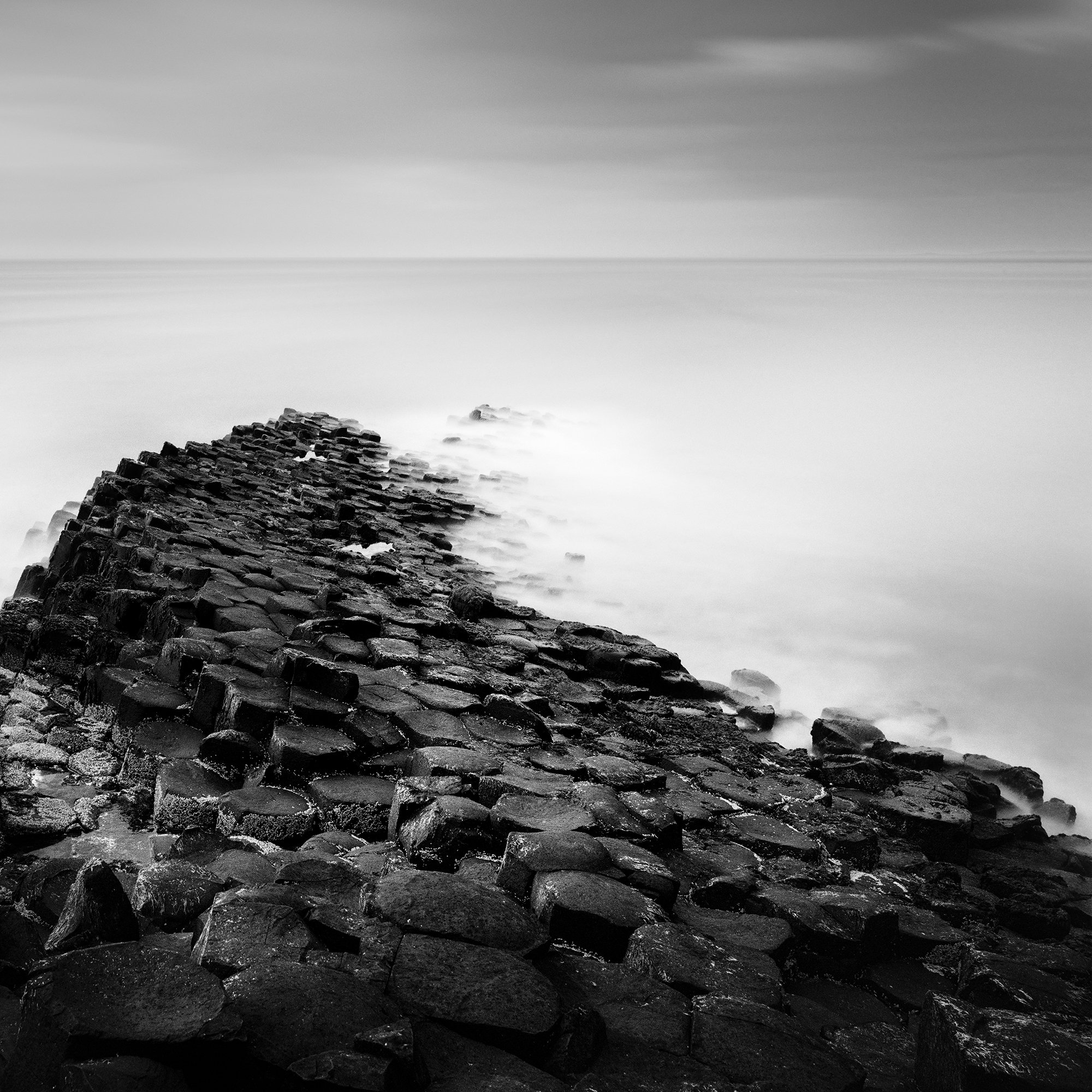 Detail of Giant’s Causeway Study 2 showing basalt formations fading into the sea by Gerald Berghammer.