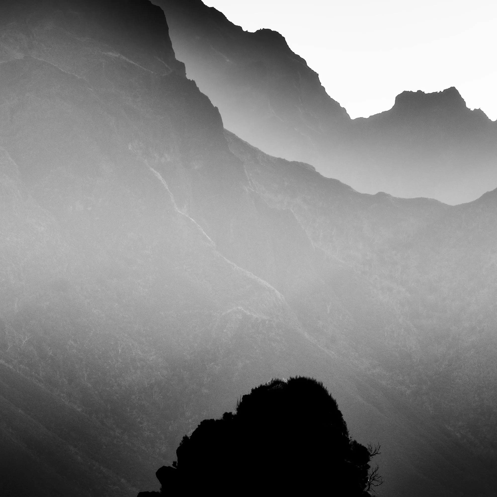 Detail of Mountains in Shadow with Morning Light by Gerald Berghammer showing atmospheric mountain ridges in Madeira.
