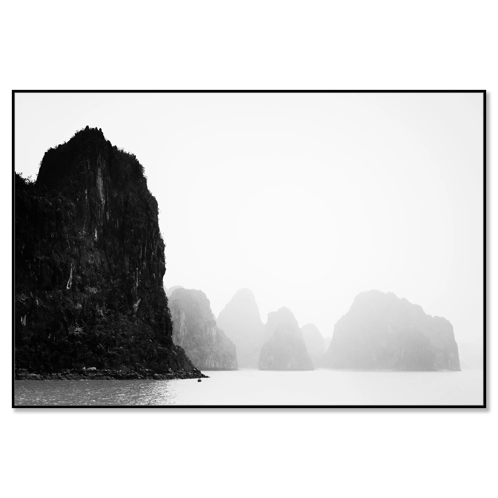 Dramatic seascape with limestone karst islands emerging from the water under a hazy, overcast sky – framed ArtBox black