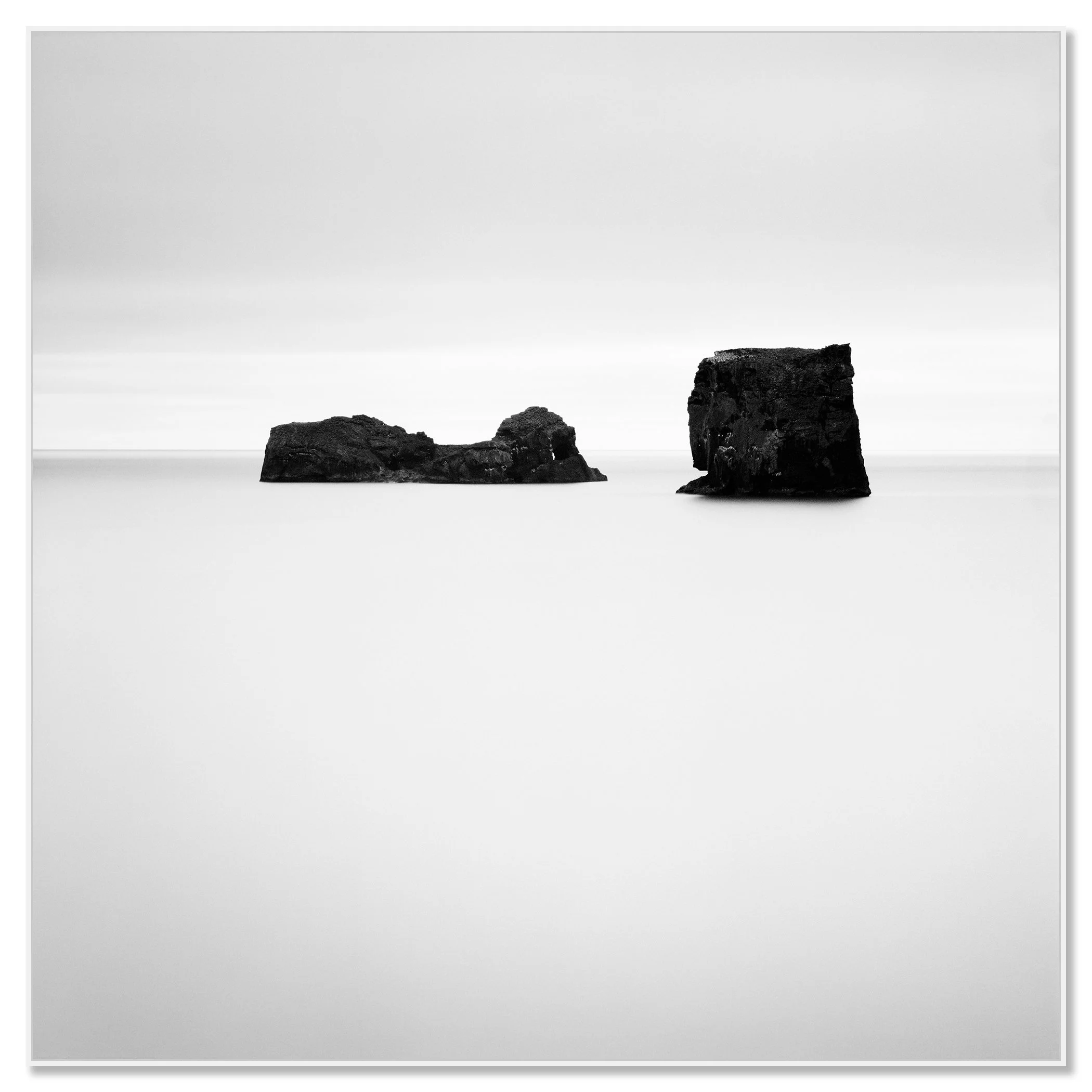 Long-exposure black-and-white seascape of ocean rocks, Iceland – framed Artbox white