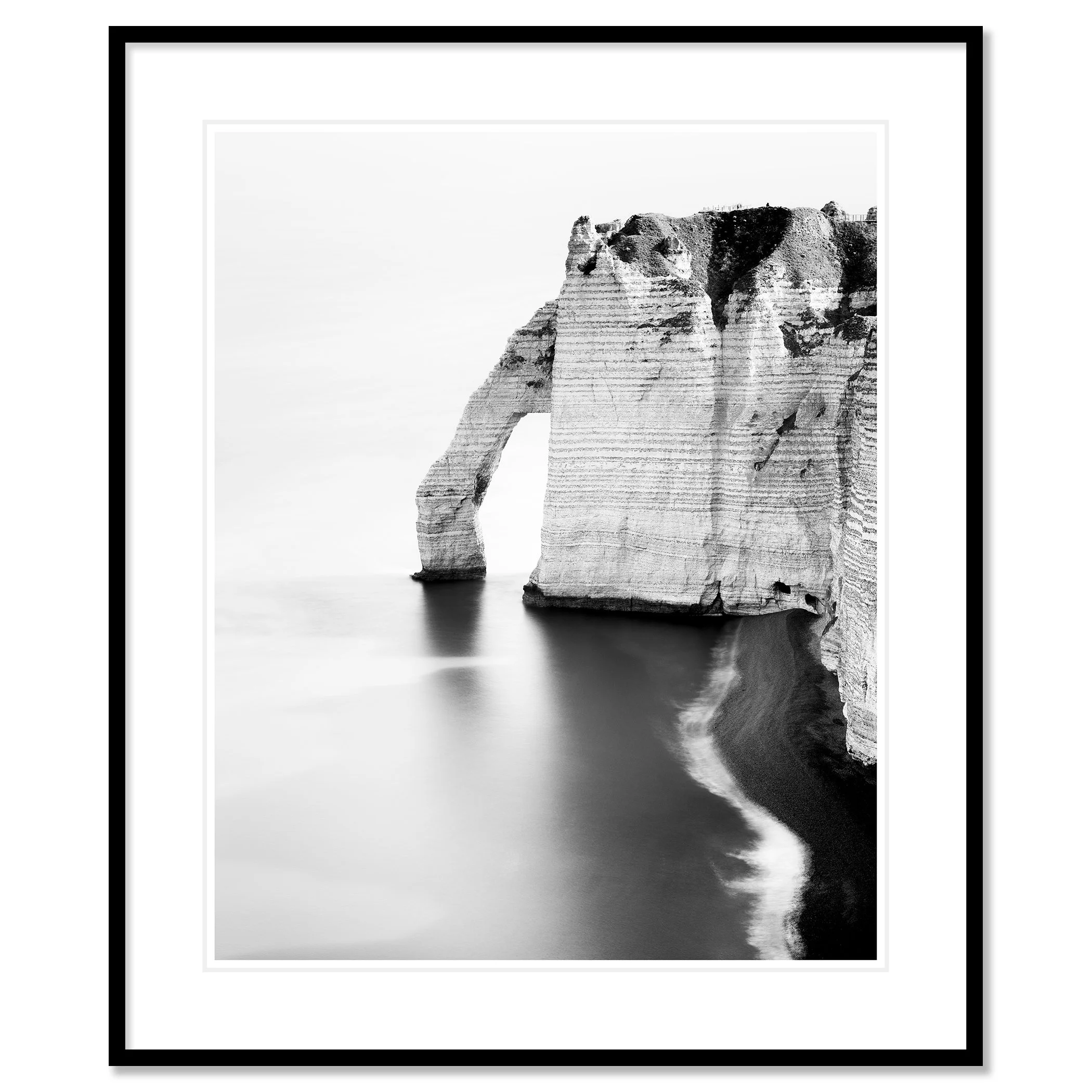 The Sea Arch at Étretat, France, black-and-white pigment print in a black aluminium frame with mount. Photo by Gerald Berghammer.