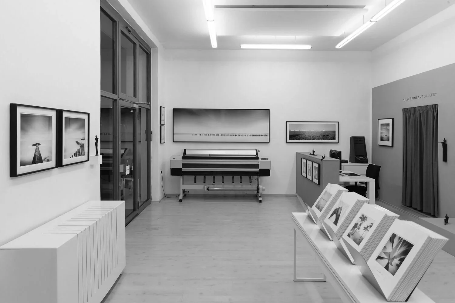 SILVERFINEART Gallery interior with framed black-and-white photographs by Gerald Berghammer and fine art print displays.