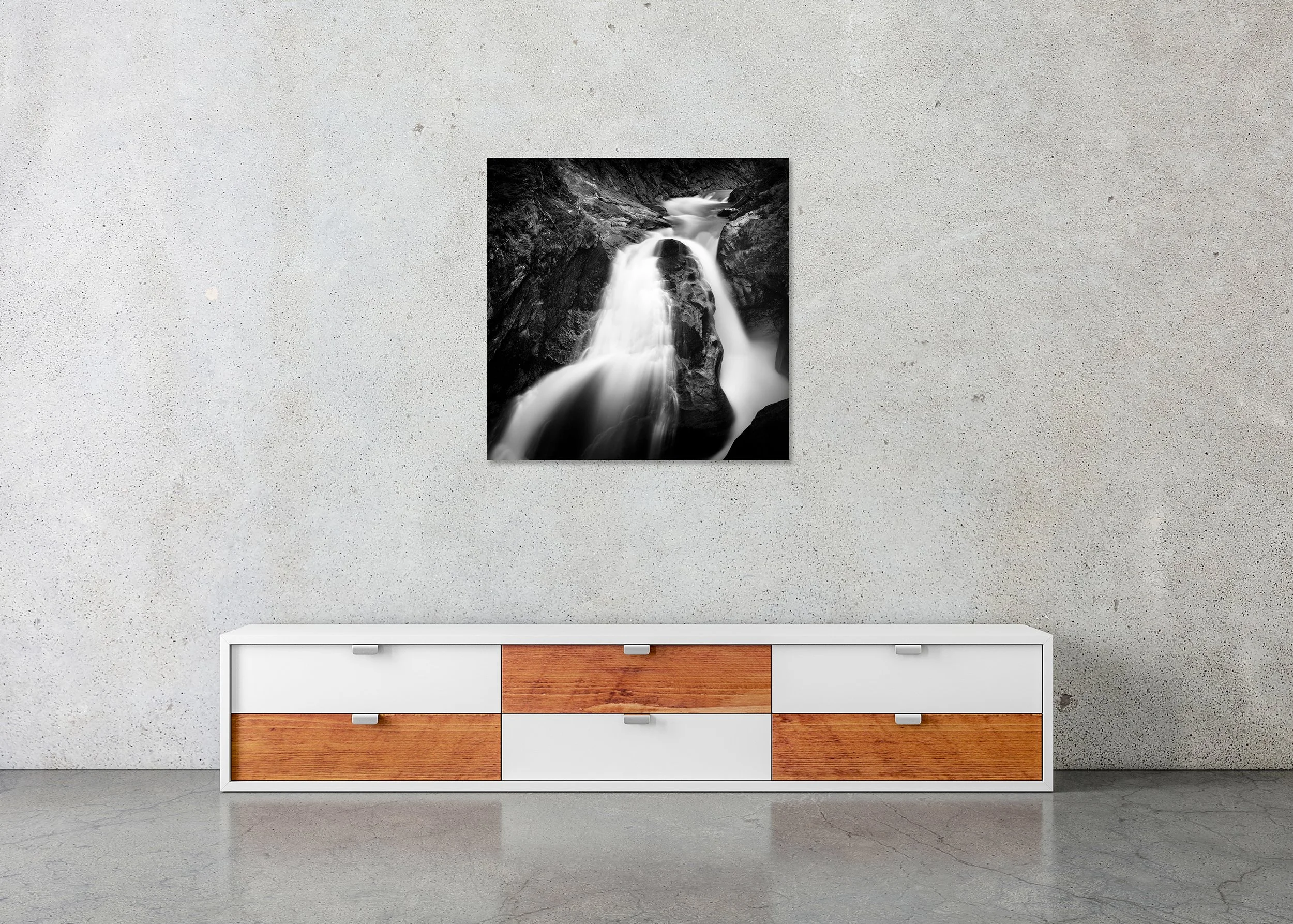 Krimmler Ache Study 1 displayed in a modern interior as a frameless black-and-white artwork mounted on aluminium Dibond by Gerald Berghammer.