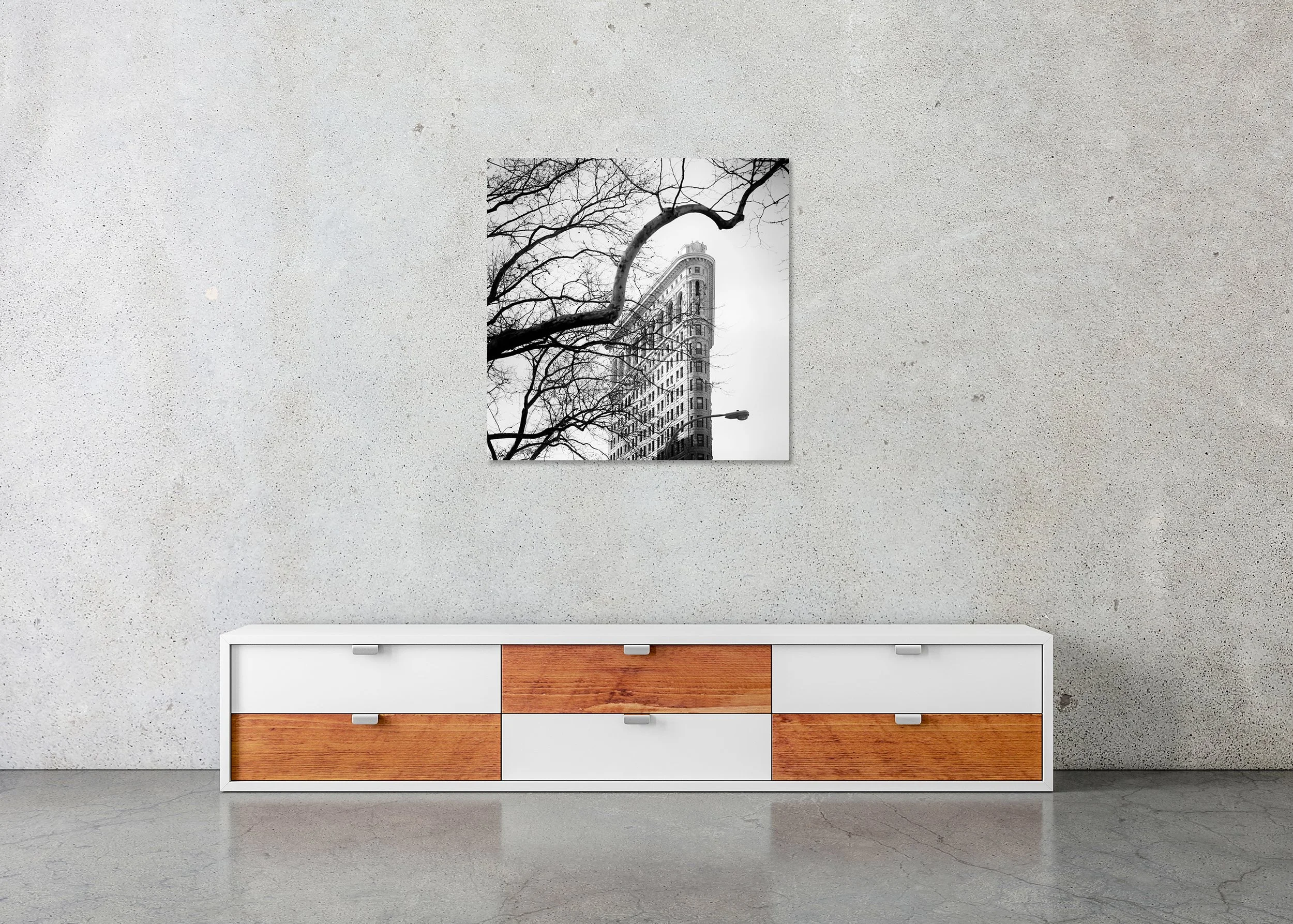 Flatiron Building Study 1 displayed in a modern interior as a frameless black-and-white artwork mounted on aluminium Dibond by Gerald Berghammer.