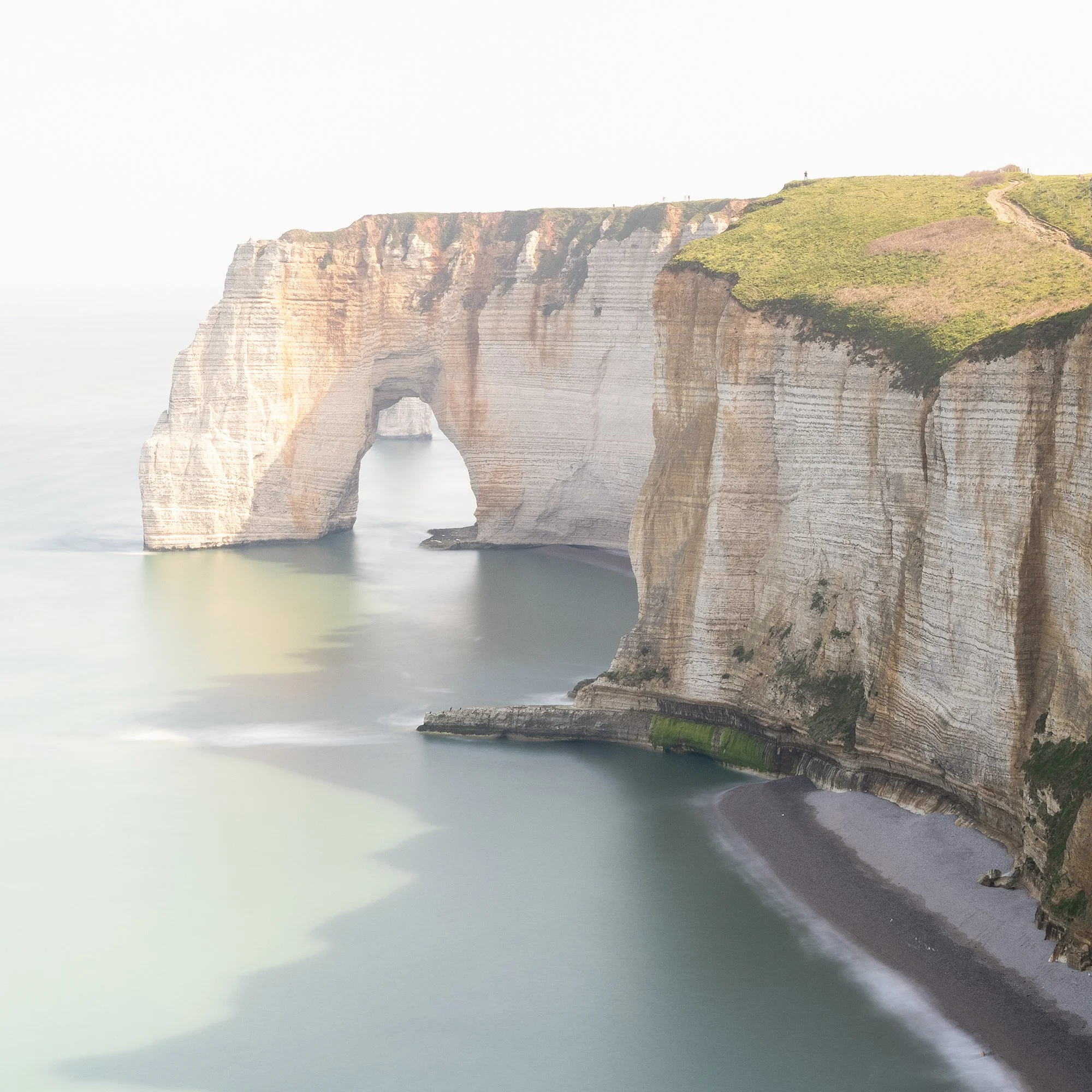 Close detail of White Cliffs Panorama Study 2 by Gerald Berghammer showing the chalk cliffs and natural sea arch at Étretat, France.