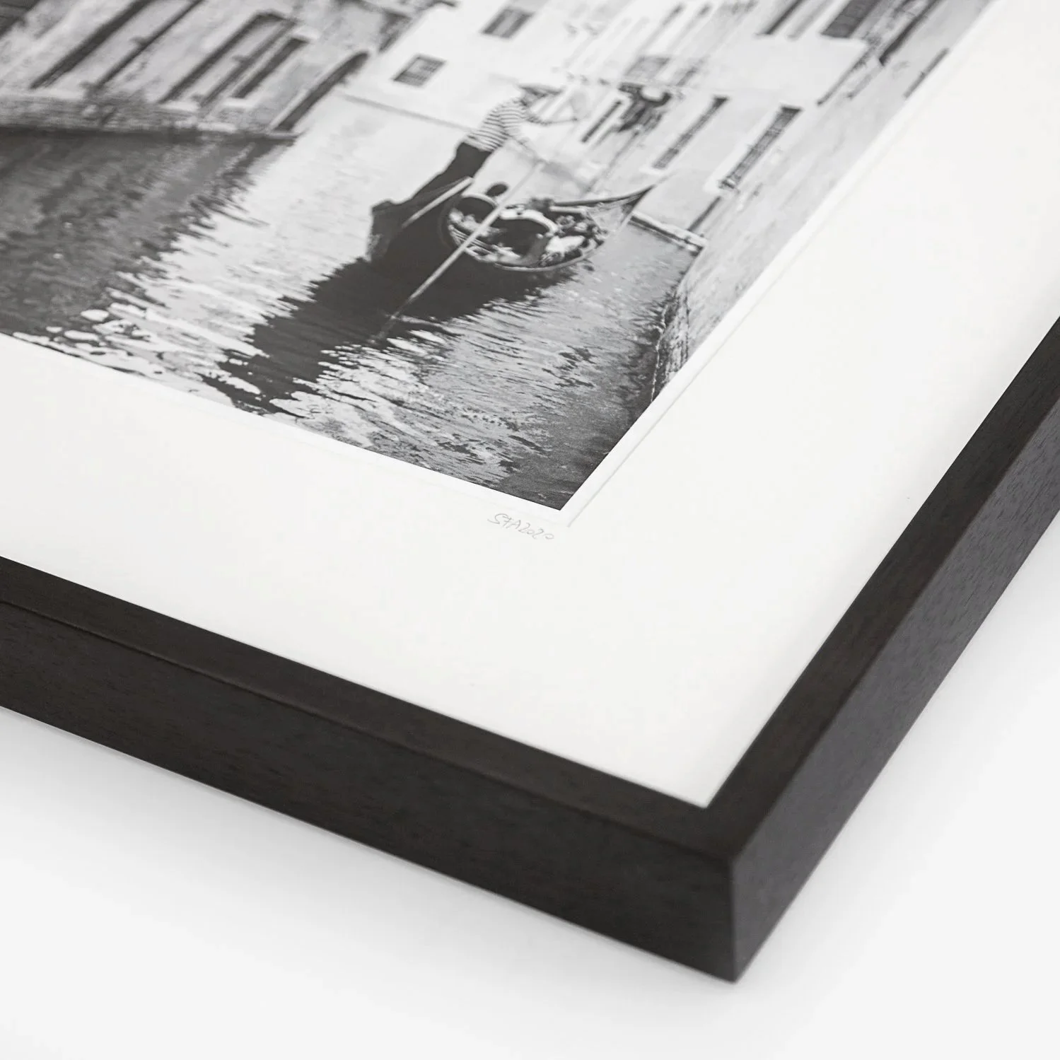 Framed print detail of Gondoliere Study 1 by Gerald Berghammer, showing the black wooden frame, white archival mount and photograph.