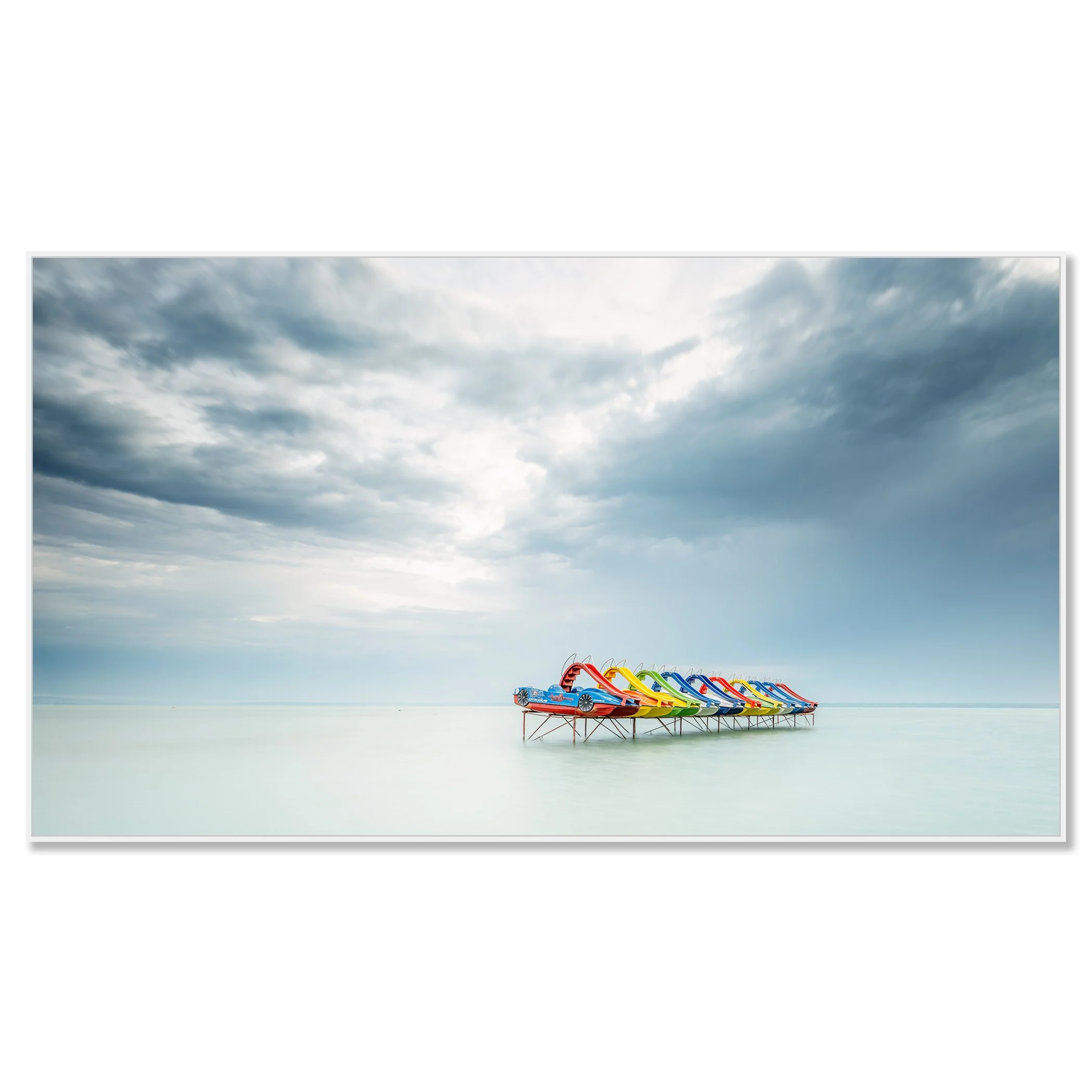 © 2021 Gerald Berghammer - Color panorama waterscape photography. A row of colorful pedal boats on the lake Balaton with dramatic cloudy sky. Chromaluxe framed white