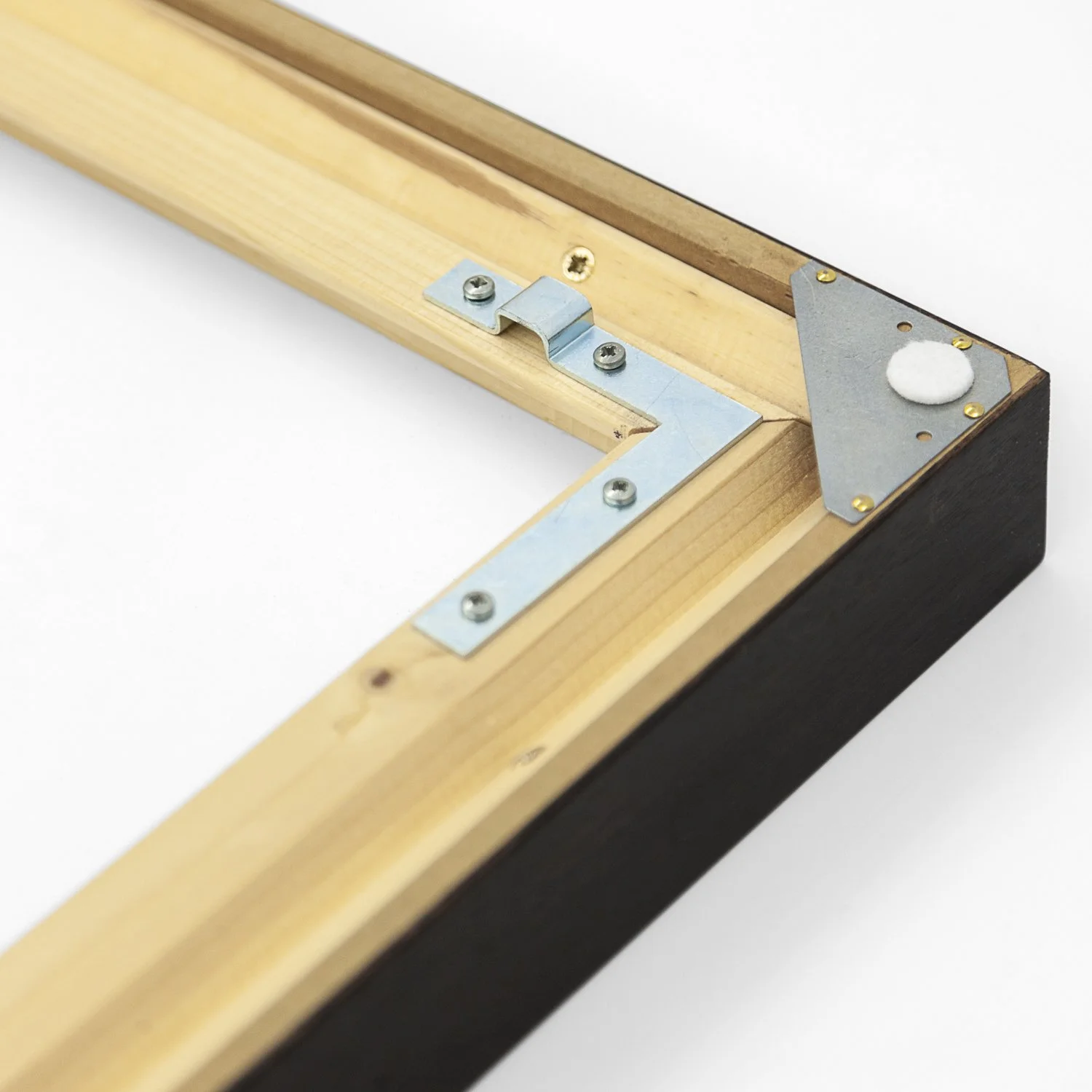Metal hanging bracket and reinforced wooden frame corner on the reverse of Gerald Berghammer's exhibited artwork.