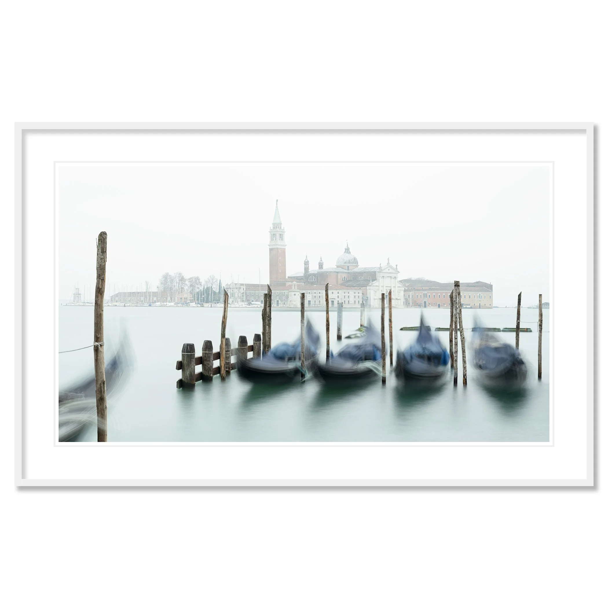 Gerald Berghammer - Color cityscape photography. Gondolas docked along wooden posts on a misty water canal and in back San Giorgio Maggiore Church. Classic framed white