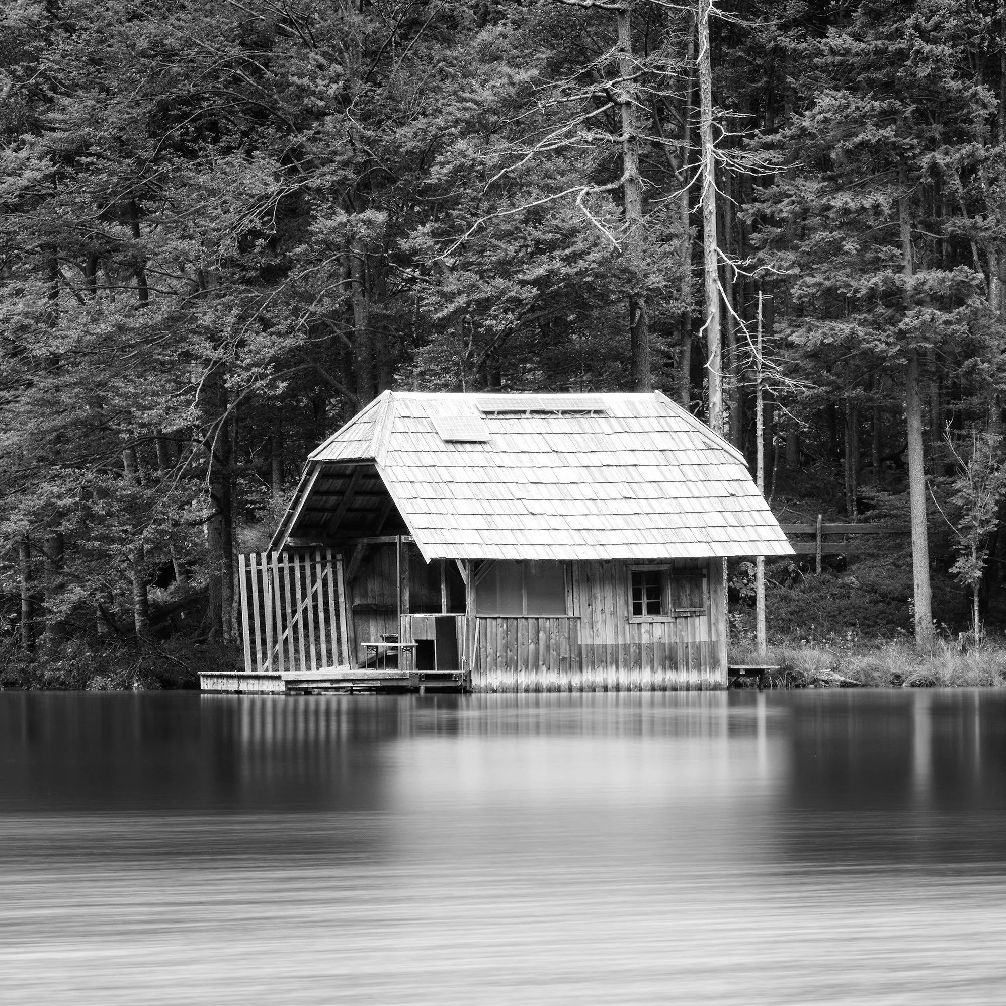 Close-up of the wooden boathouse at Langbathsee in Wooden Boathouse Panorama by Gerald Berghammer.