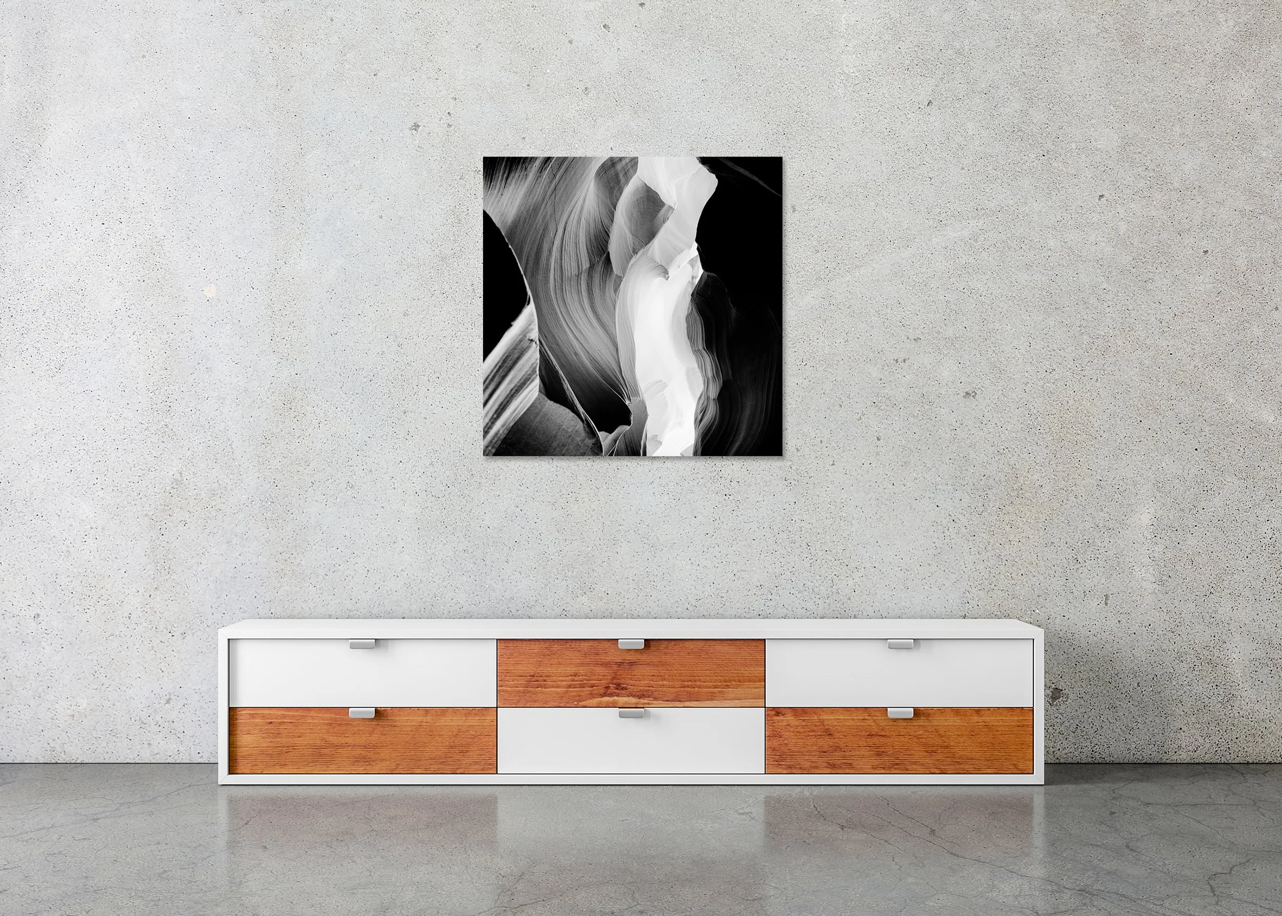 Black-and-white photo of flowing sandstone slot canyon walls with layered textures and dramatic light, photo print mounted to Dibond, frameless.