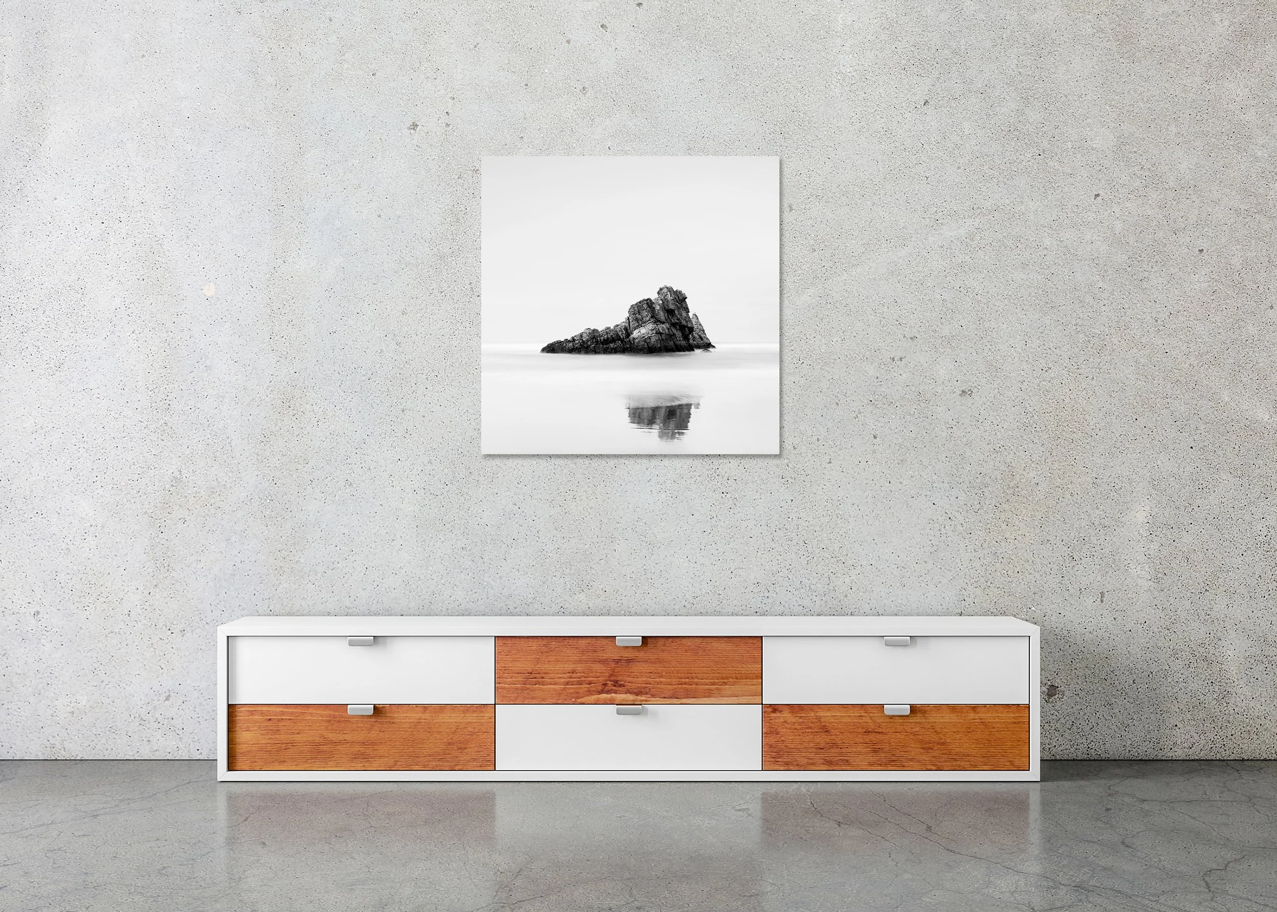 Rock on the Beach, Study 1 – frameless black-and-white photograph on aluminium Dibond displayed above a low cabinet