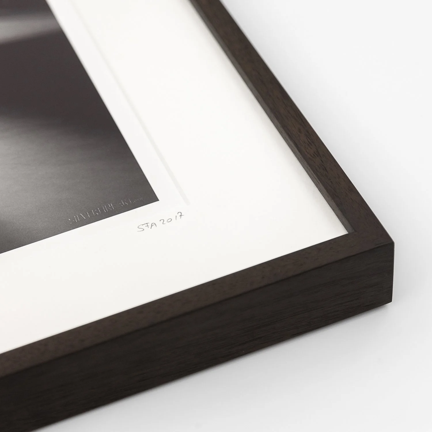 Detail of Gondola Study 1 by Gerald Berghammer, showing the dark-brown wooden frame, white archival mount and handwritten marking.