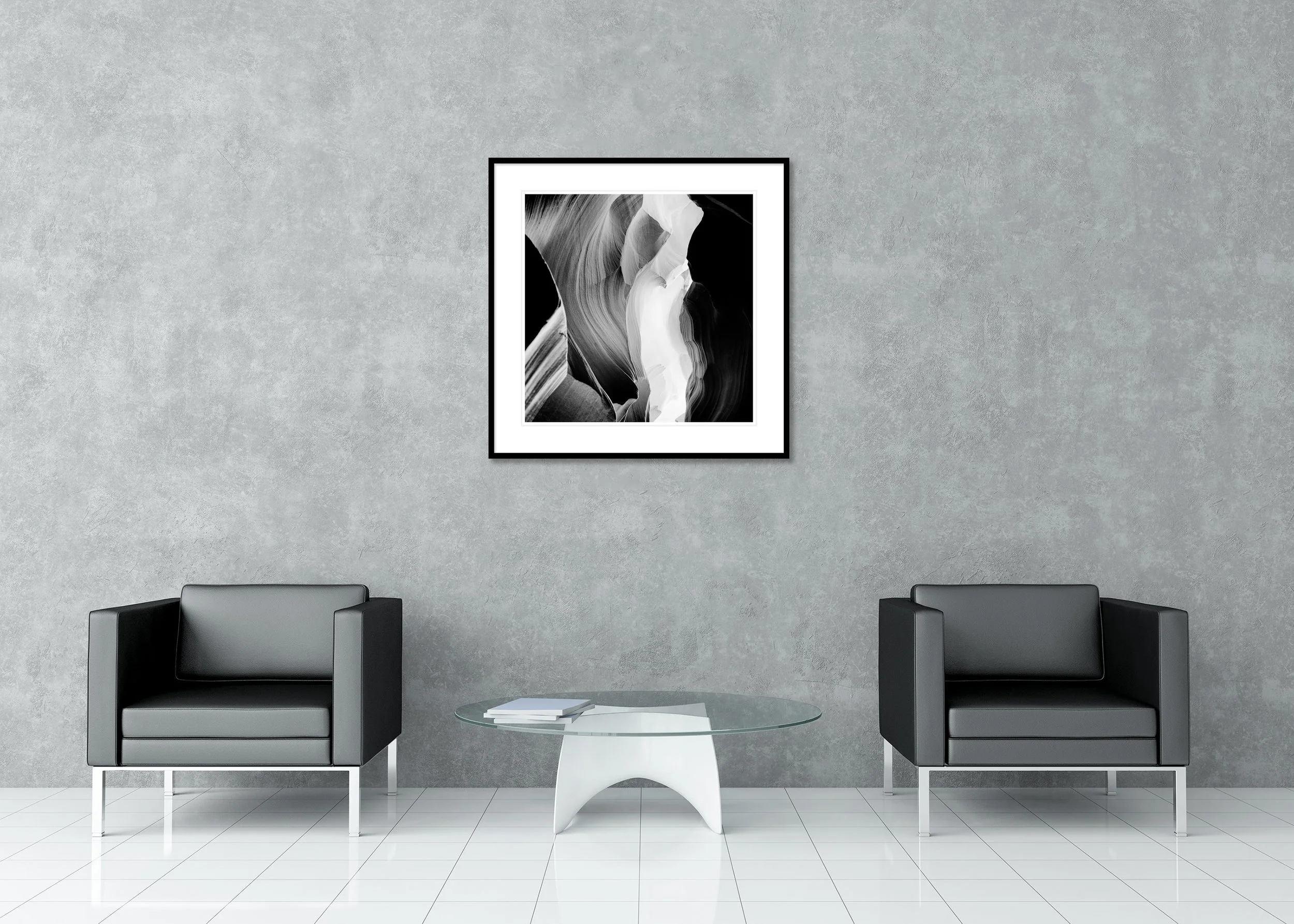 Black and white photograph of smooth, flowing slot canyon sandstone walls with layered rock textures and dramatic natural light and shadow, archival pigment print in a classic frame with passe-partout