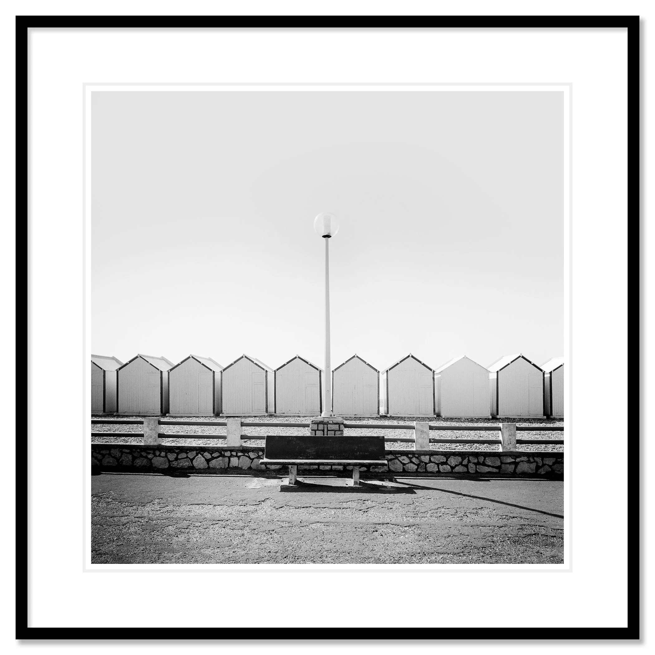 Bench on the Promenade Study 1 as an archival pigment print in a black aluminium frame with a white mount by Gerald Berghammer.