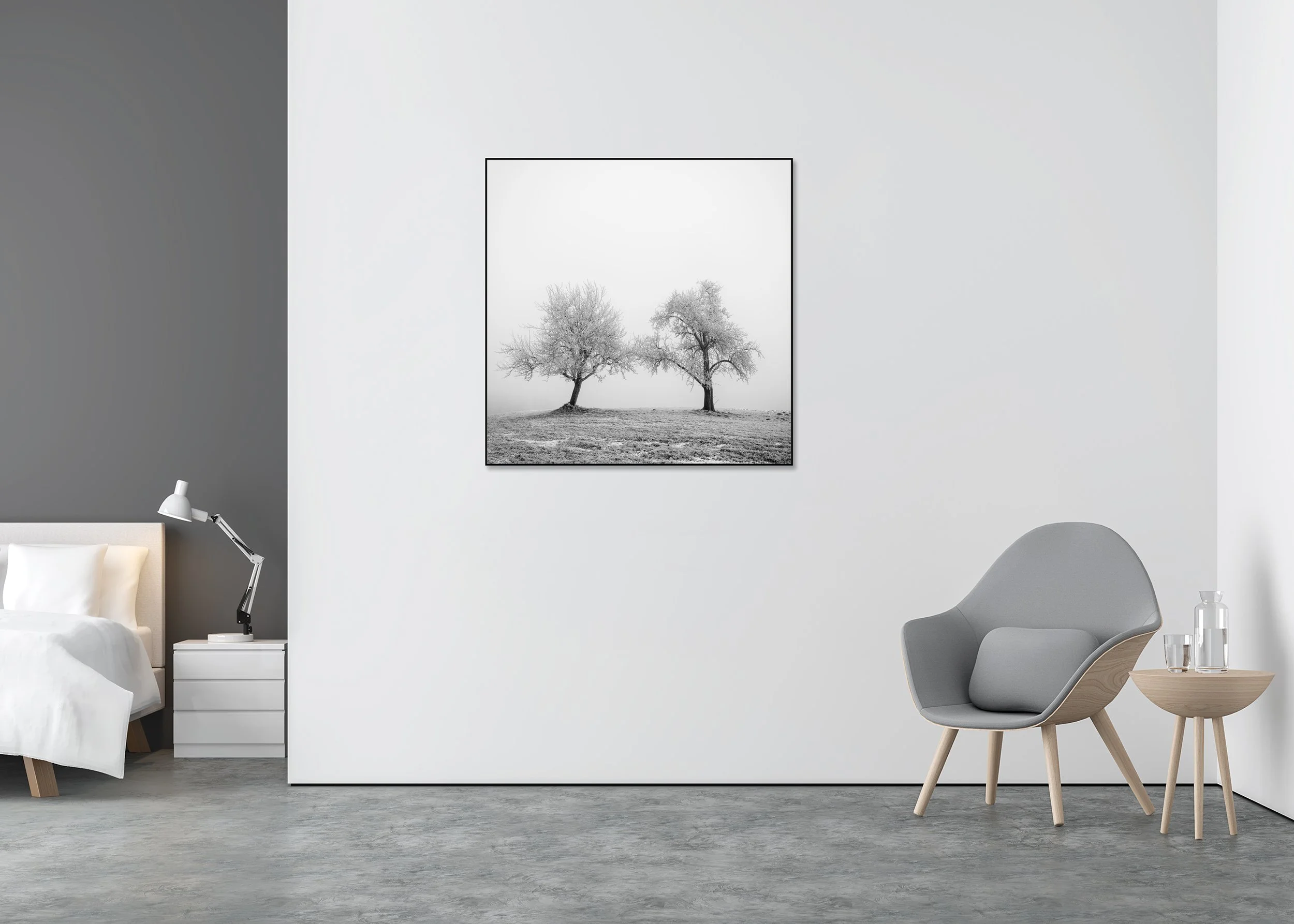 Black and white photograph of two frost-covered trees standing on a gentle hill in a minimalist winter landscape, Chromaluxe framed fine art by Gerald Berghammer.