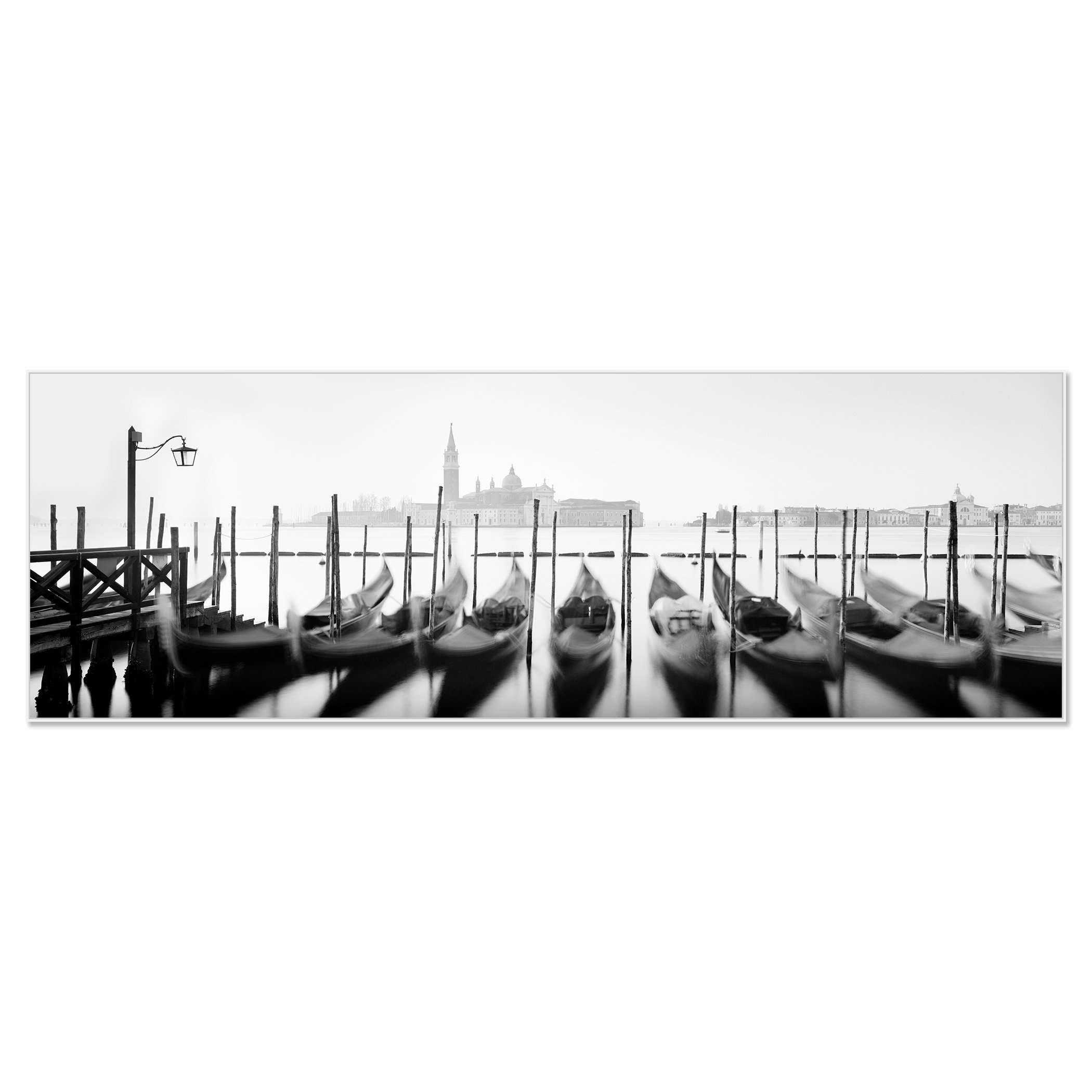 Black-and-white photo of gondolas moored on a Venice canal with historic buildings and a clock tower – framed ArtBox white