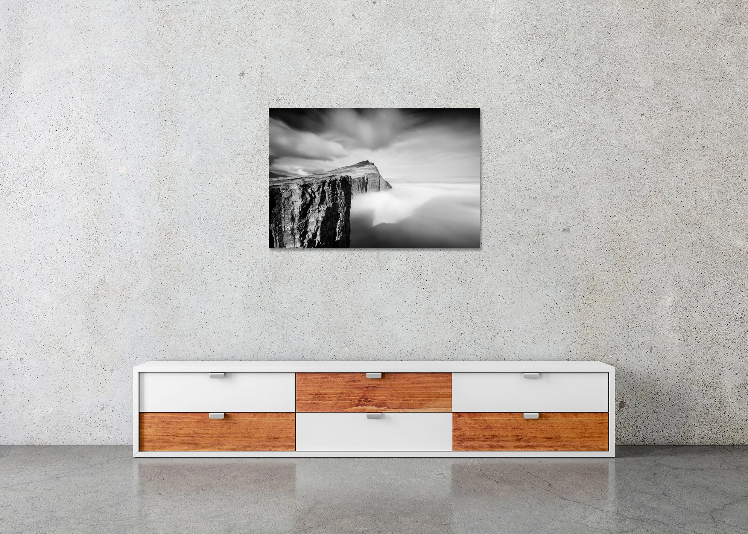 Foggy Slave Cliff, Study 1 – frameless black-and-white photograph on aluminium Dibond above a low cabinet.