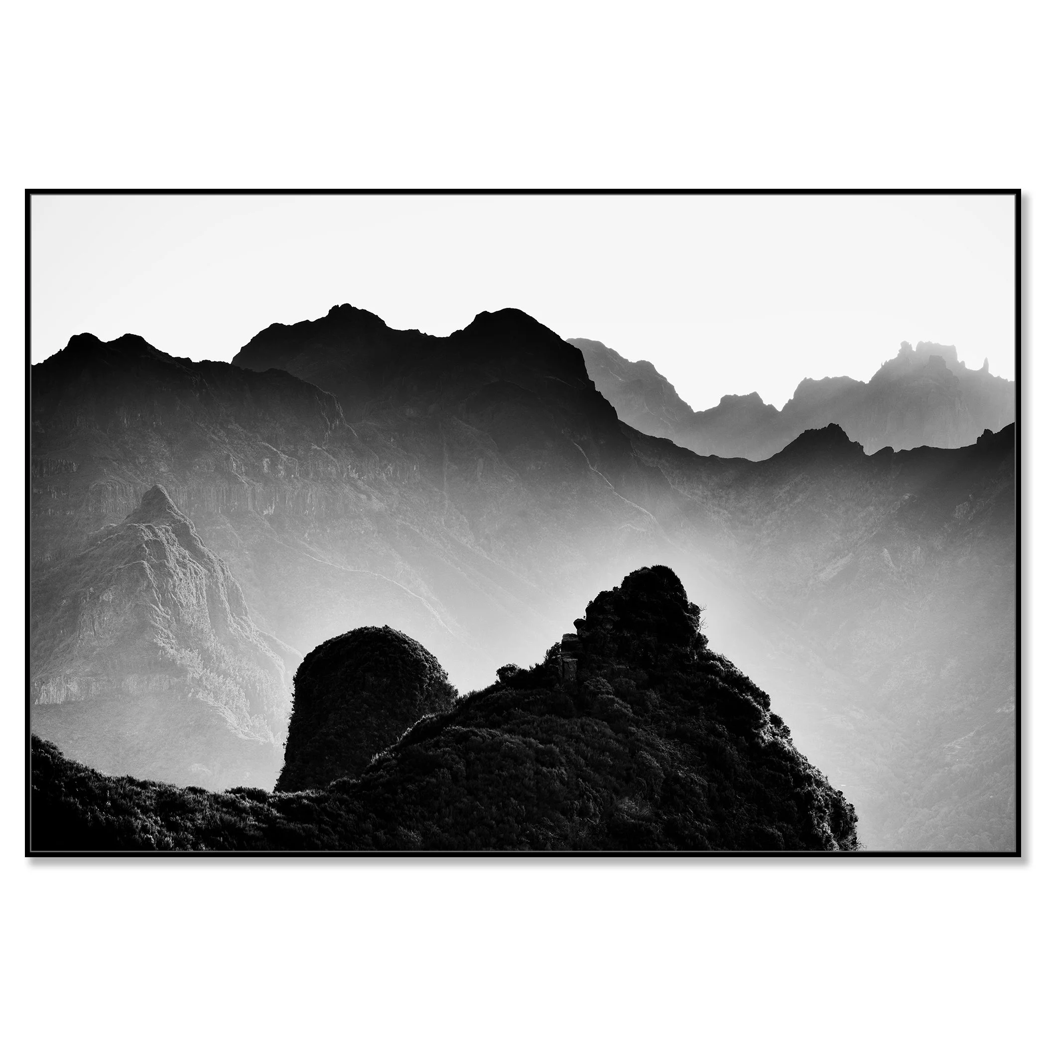 Black and white mountain landscape with layered rocky peaks and soft mist in the background – framed ArtBox black