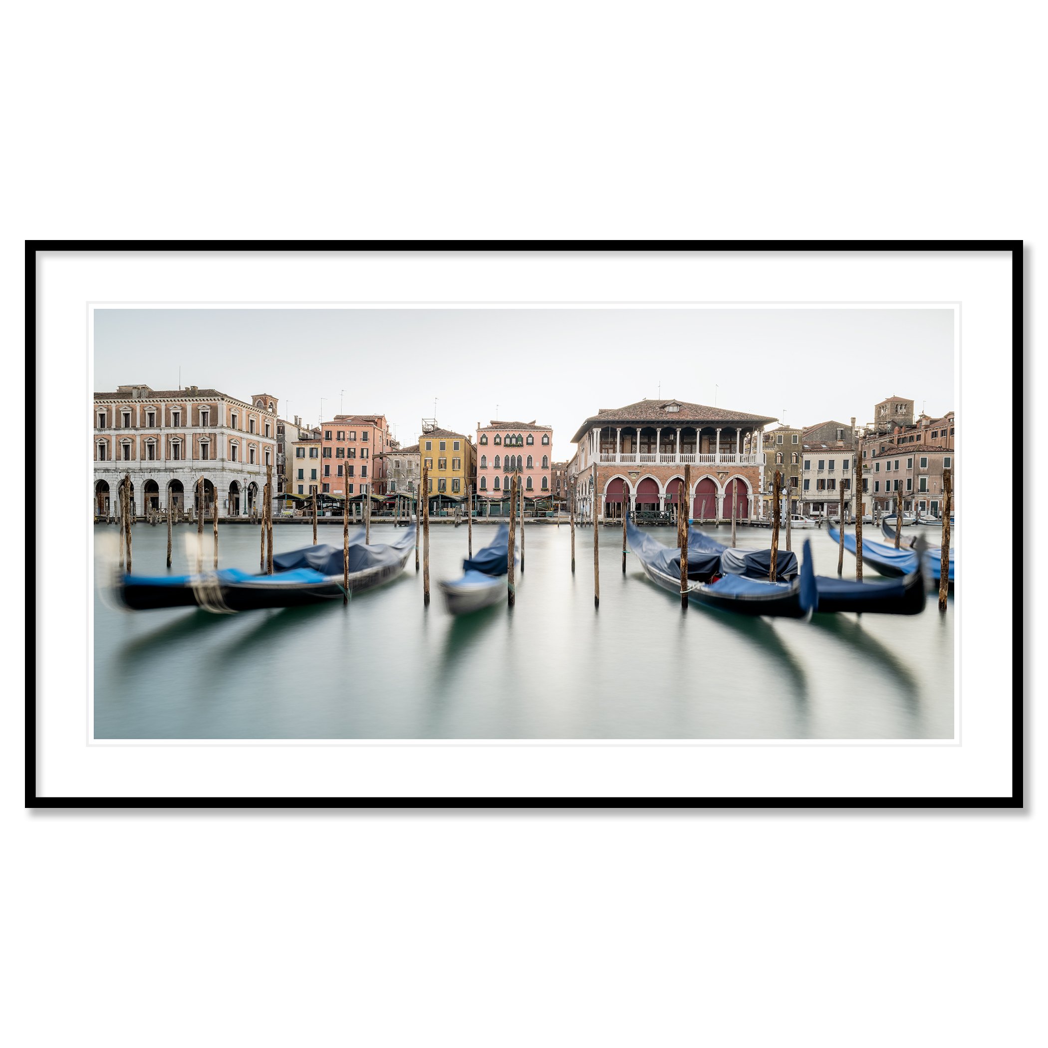 © 2025 Gerald Berghammer - Color cityscape photography. Gondolas docked along a canal in Venice, Italy, with historic buildings and the fish market in the back. Classic framed black