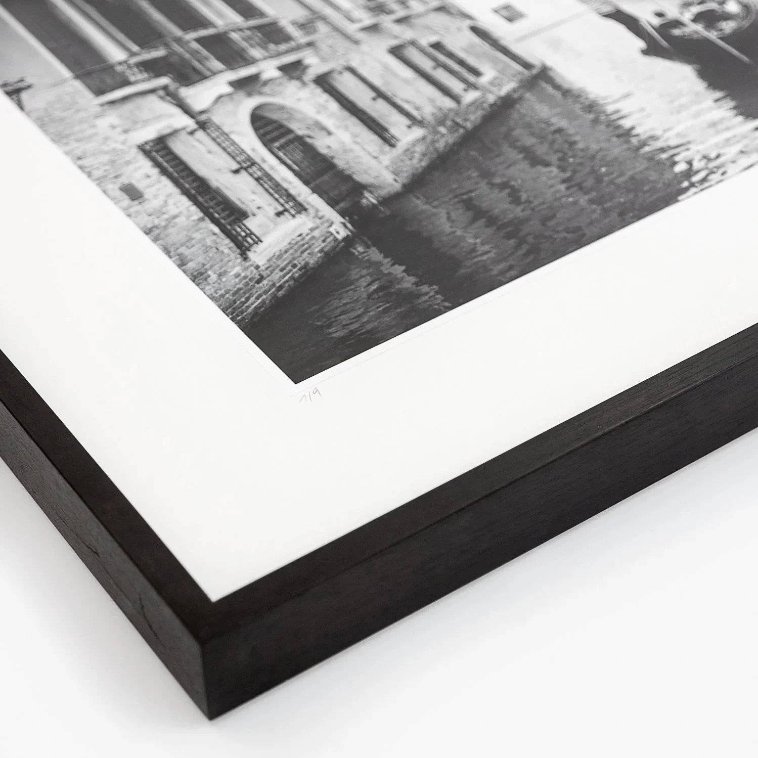 Close-up of the black wooden frame, archival mount and photographic print of Gondoliere Study 1 by Gerald Berghammer.