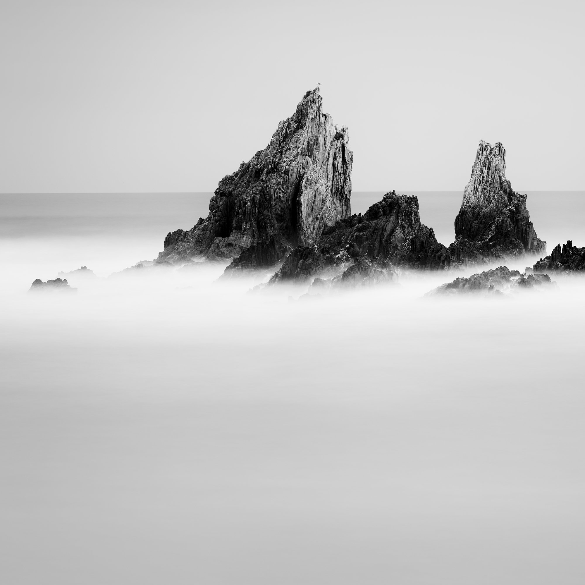 Detail of Rocky Peaks Study 1 by Gerald Berghammer, black-and-white long-exposure photograph of jagged Atlantic sea stacks in Spain.