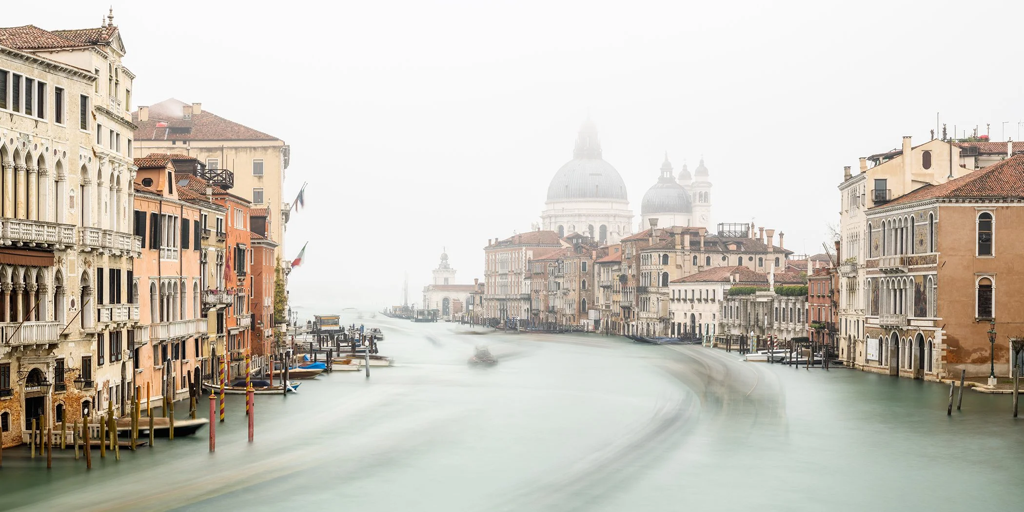 Venice’s Grand Canal and Basilica di Santa Maria della Salute in atmospheric morning mist, photographed by Gerald Berghammer.