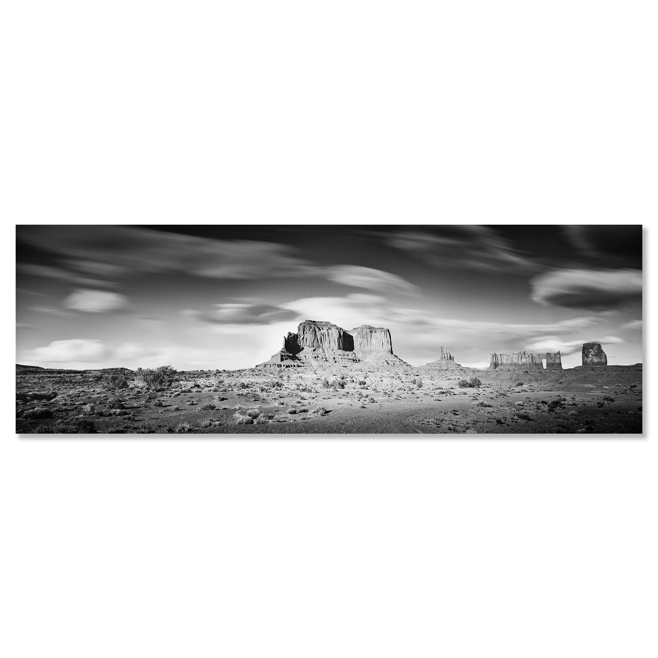 © 2015 Gerald Berghammer - Black and white photography. Landscape of rugged desert terrain with large rock formations and scattered vegetation under a cloudy sky. Chromaluxe frameless