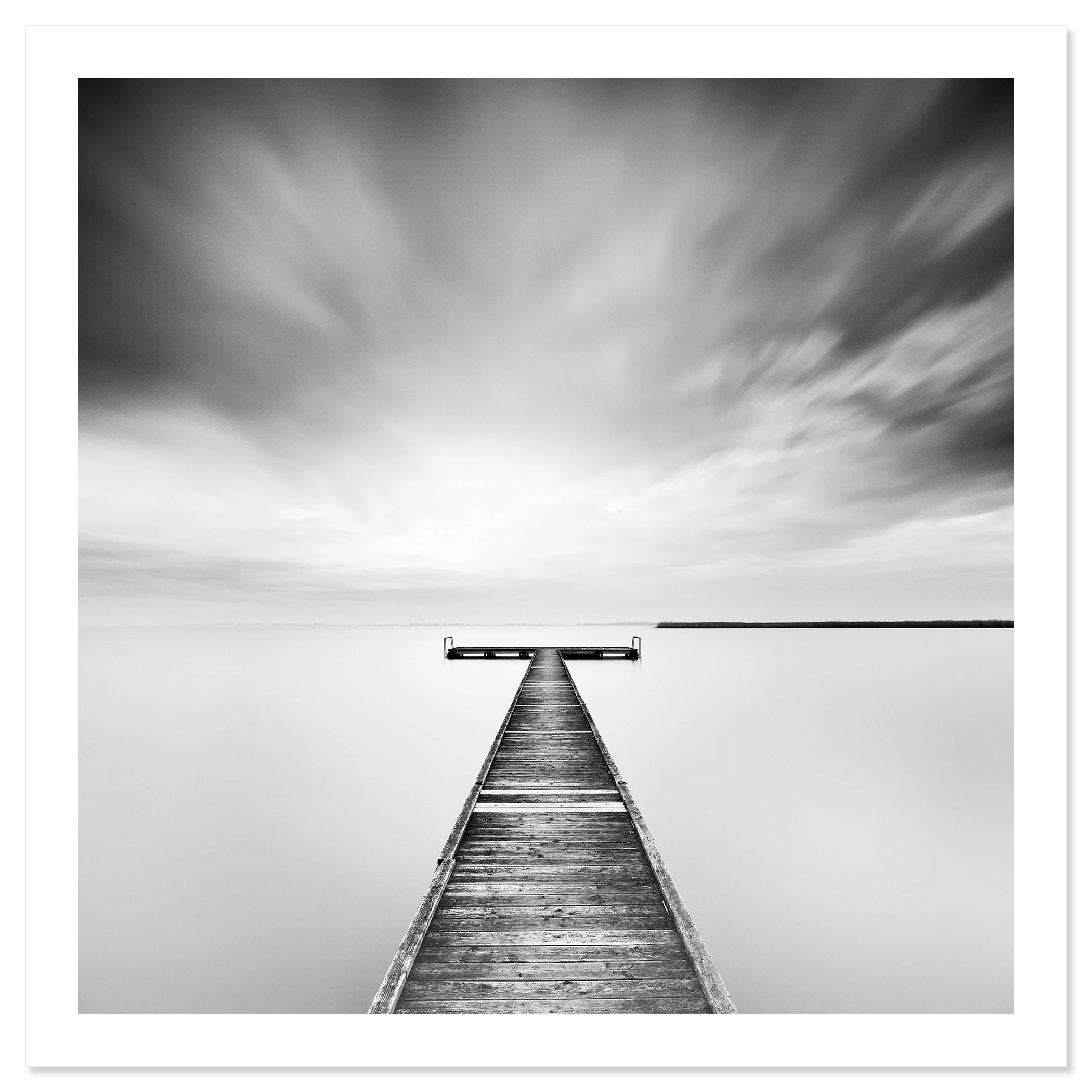 Winter Storm by Gerald Berghammer, an analogue black-and-white fine art print of a wooden jetty on Lake Neusiedl, Austria.