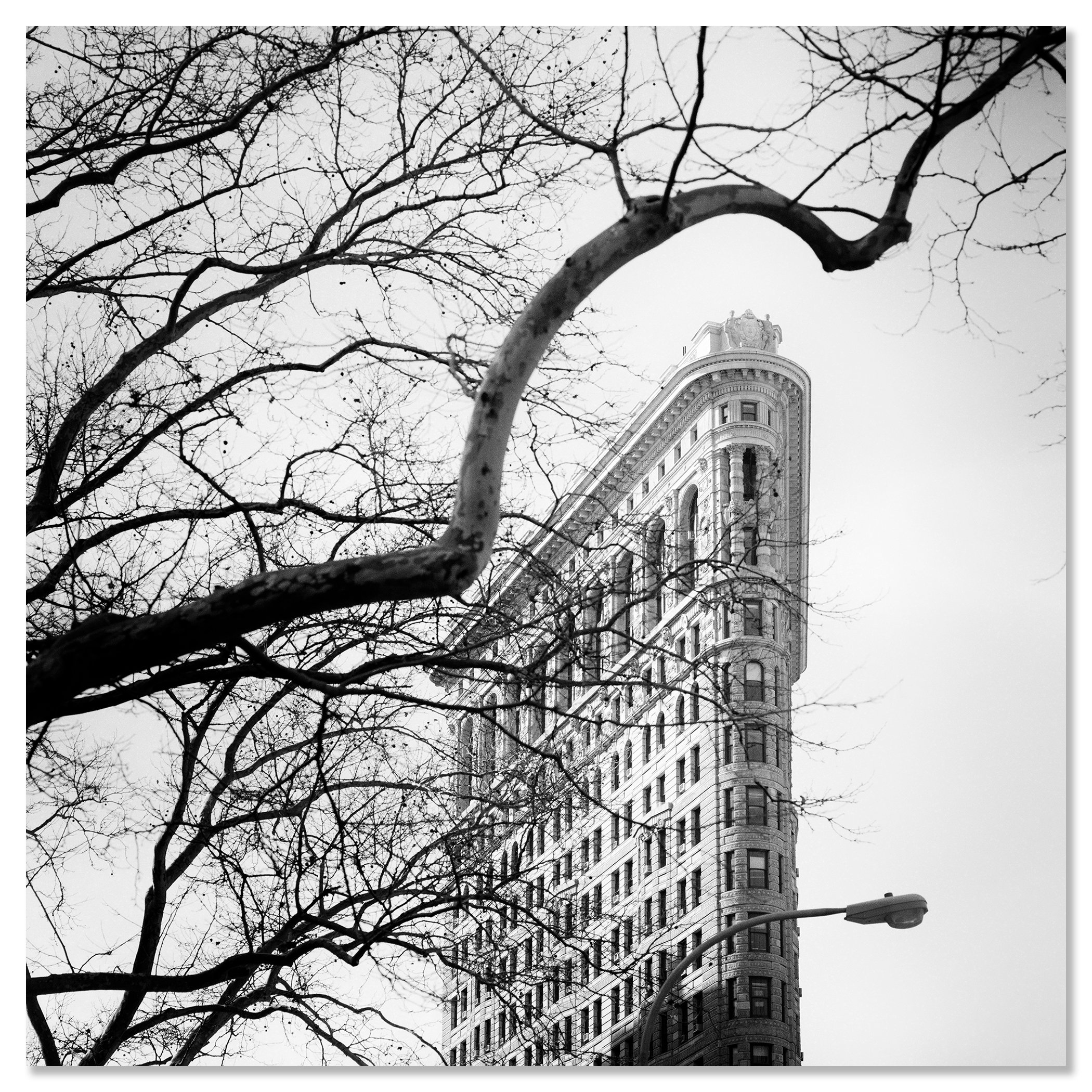 Flatiron Building Study 1 by Gerald Berghammer shown as a frameless black-and-white artwork mounted on aluminium Dibond.
