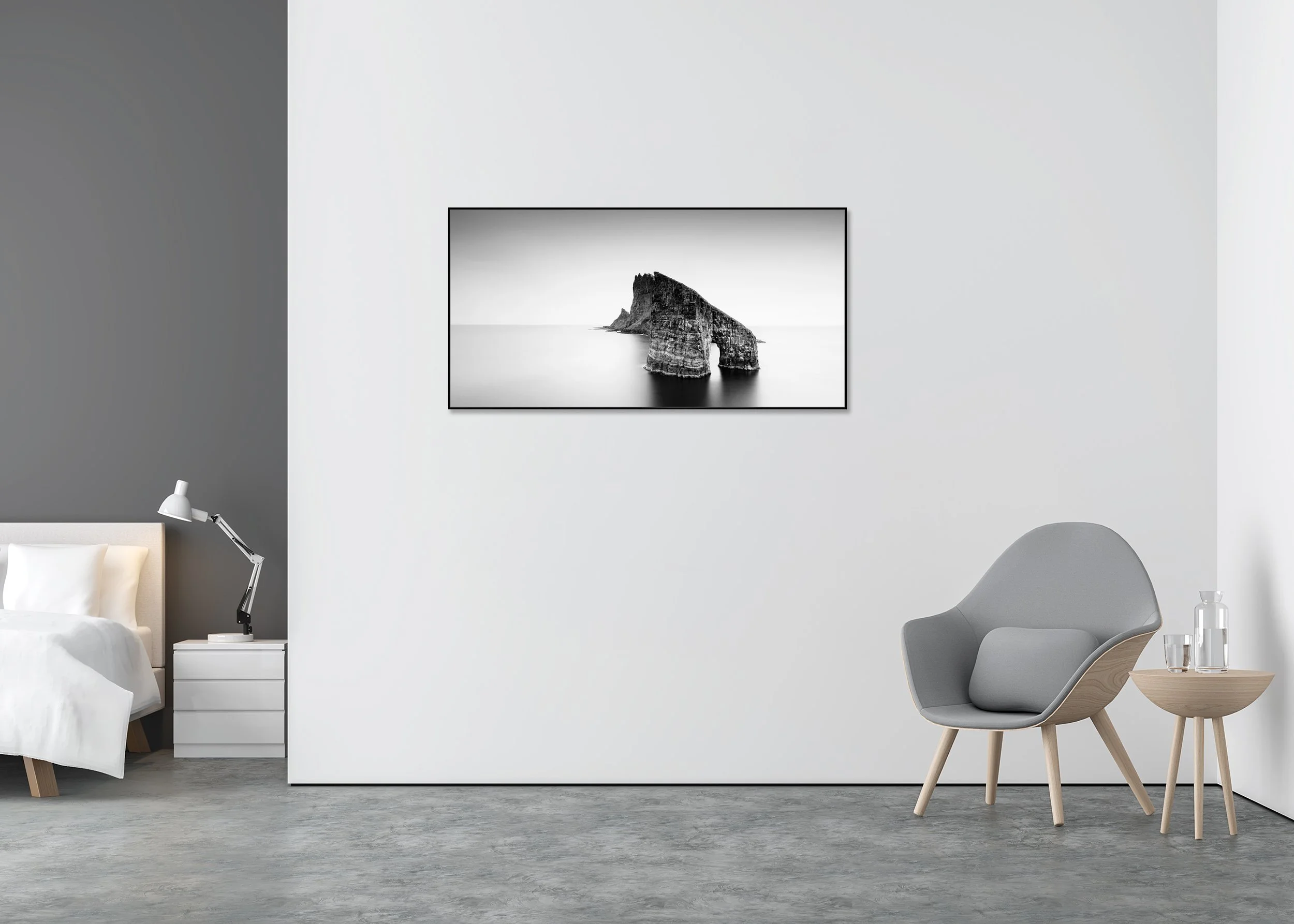 Drangarnir Sea Arch Panorama displayed in a modern interior as a black-and-white Dibond print in a black aluminium ArtBox frame by Gerald Berghammer.