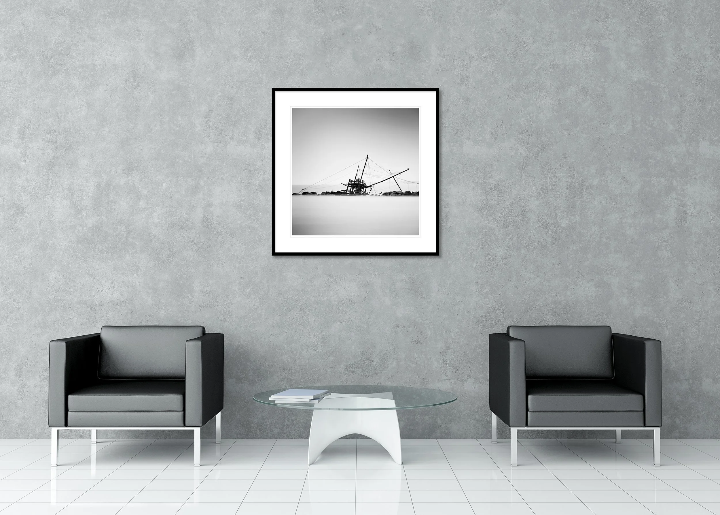 Black-and-white archival pigment print of an abandoned fishing hut at Bocca d'Arno, with calm water and a rocky shore, in a classic frame with mount.