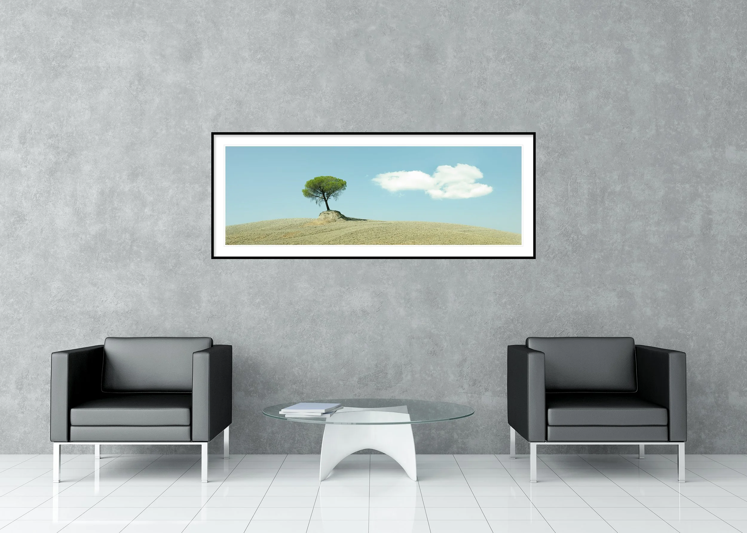 Single green tree on a dry hillside in Tuscany beneath a clear blue sky, archival pigment print in a classic frame with a mount