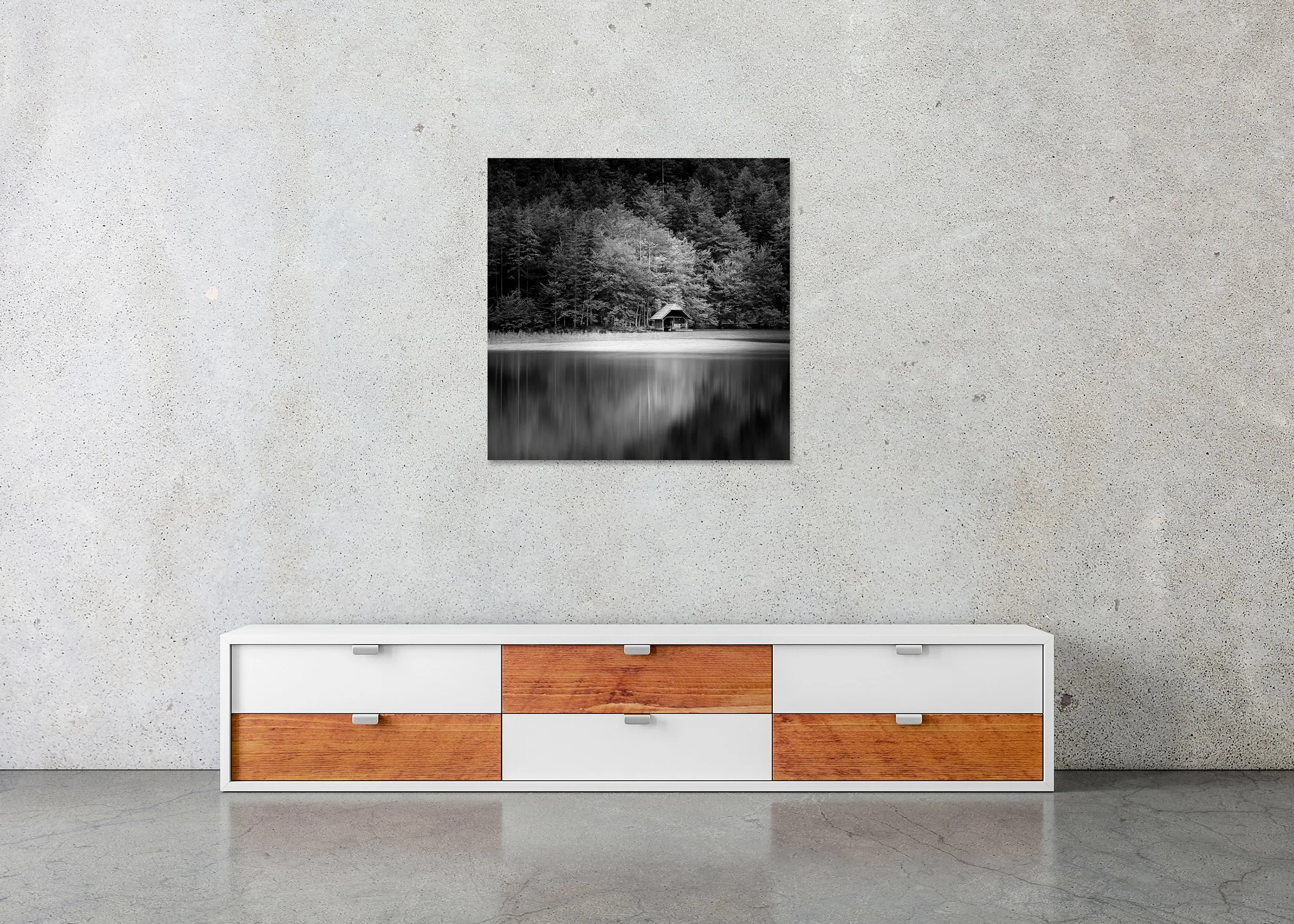 Wooden Boathouse, Study 2 – frameless black-and-white photograph on aluminium Dibond displayed above a low cabinet.