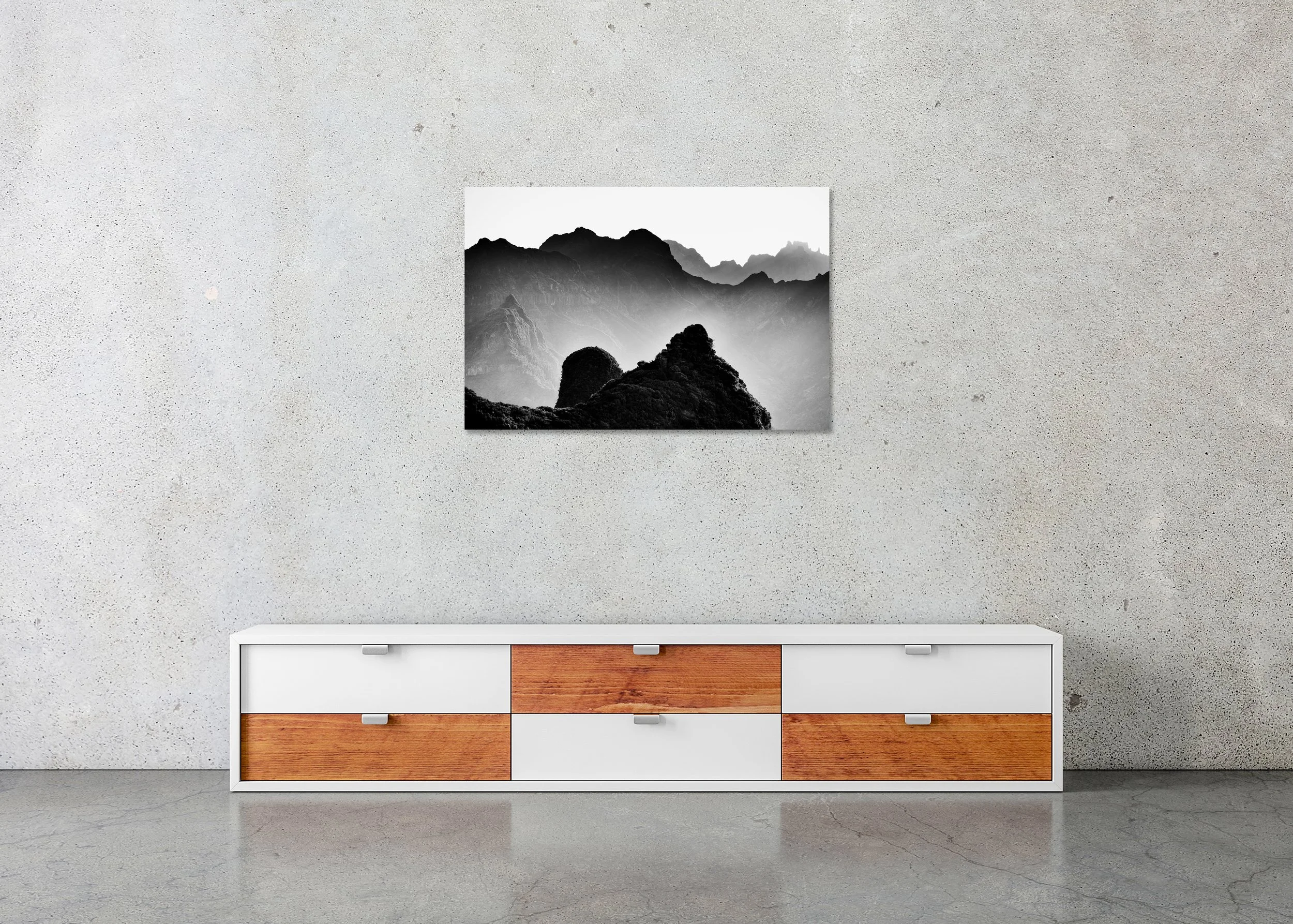 Black and white mountain photograph with steep peaks and textured hills fading into mist, photo print mounted to Dibond, frameless