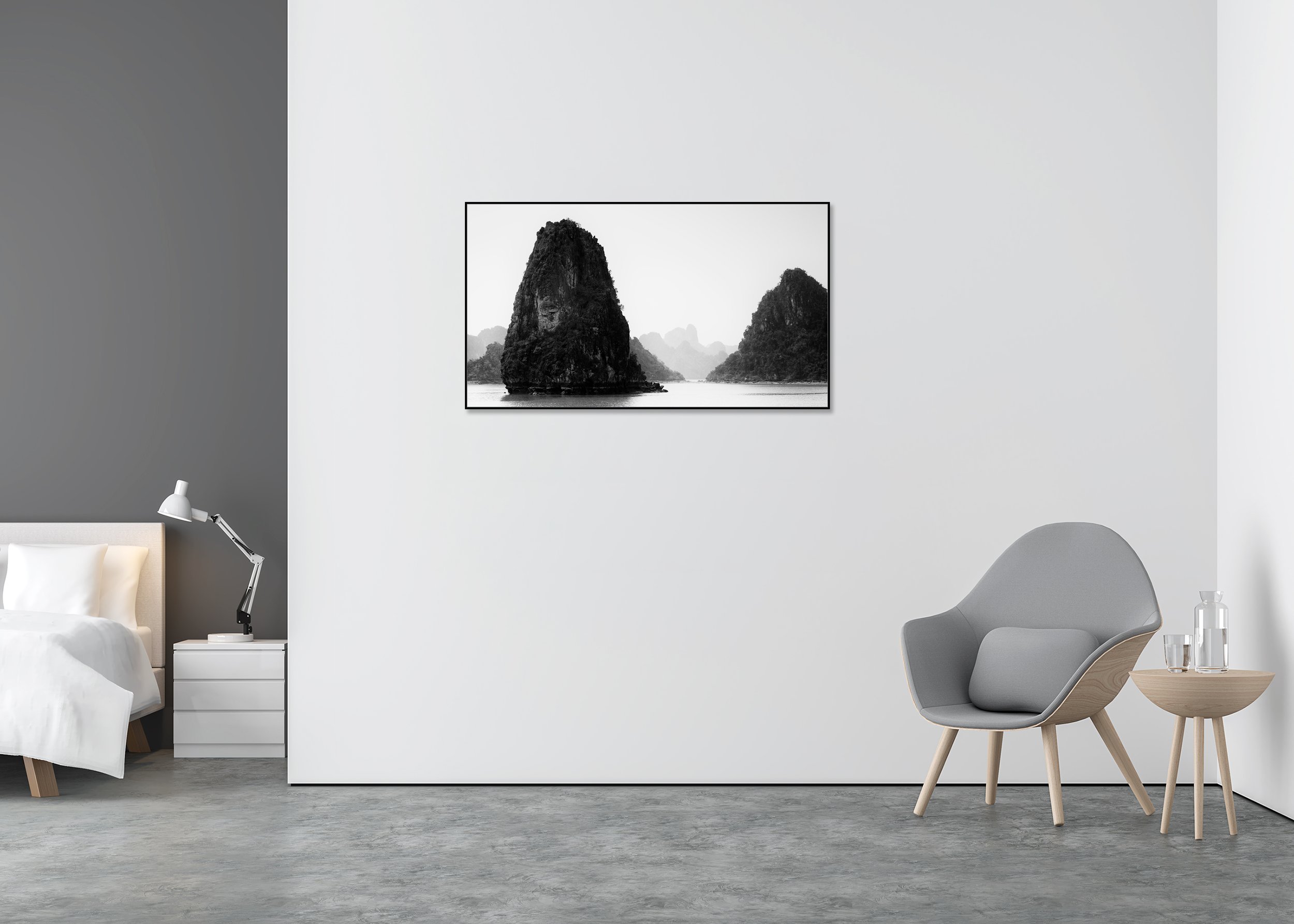 Black-and-white photo of misty limestone karsts rising from calm water in Ha Long Bay, Vietnam, on a ChromaLuxe metal print in an aluminium ArtBox frame.