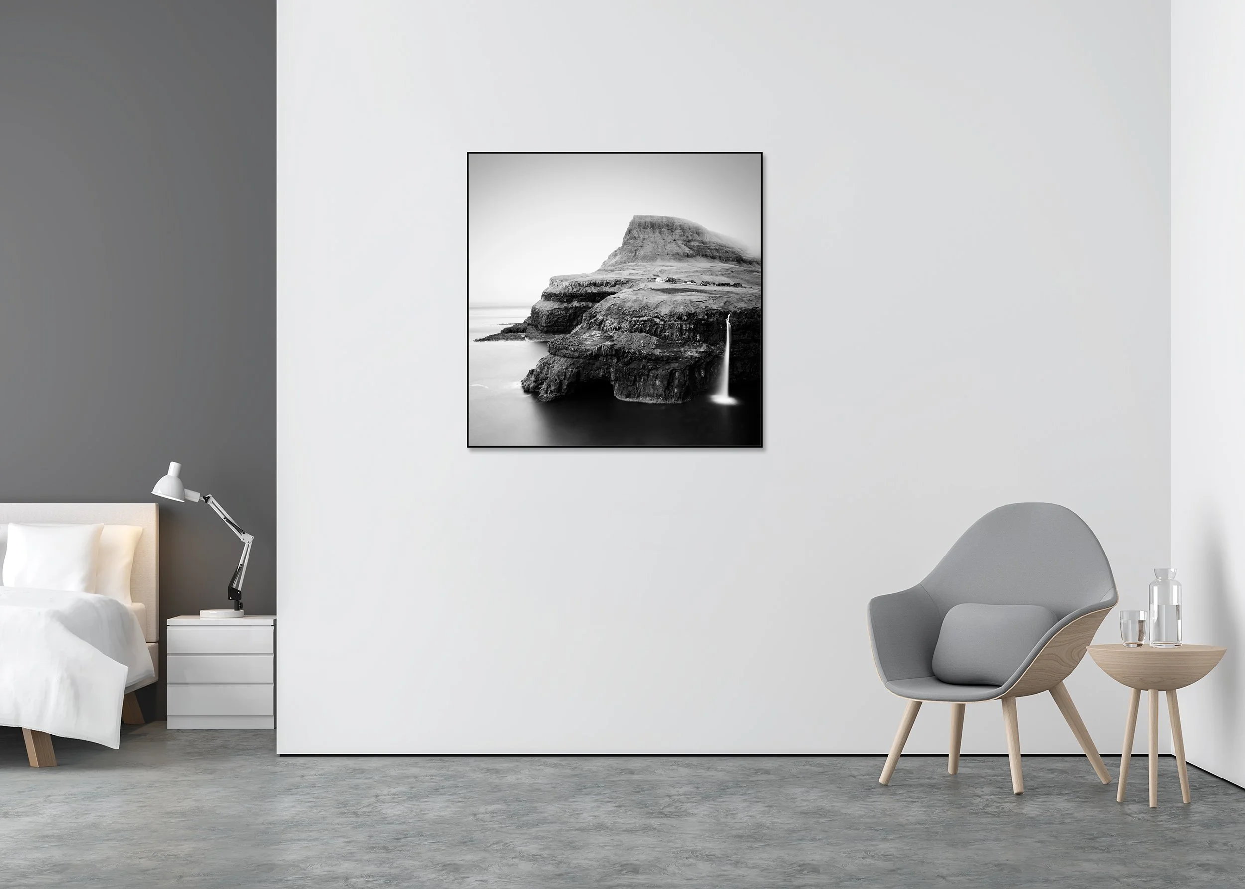 Black-and-white photo print of a Faroe Islands coastal cliff with waterfall flowing into the ocean near a remote village, mounted to Dibond in an aluminium ArtBox.