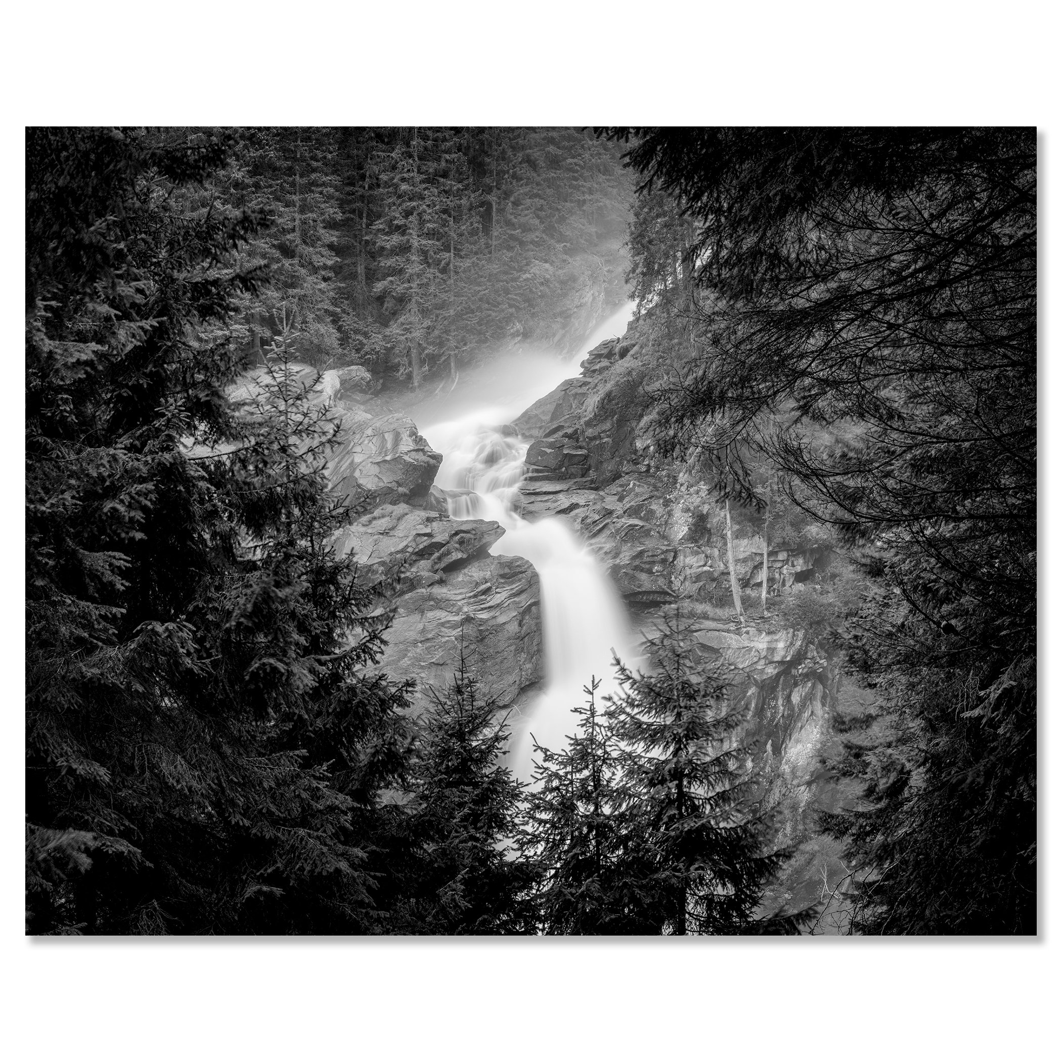Krimml Waterfalls in monochrome, flowing through rocky forest scenery in Austria – dibond frameless