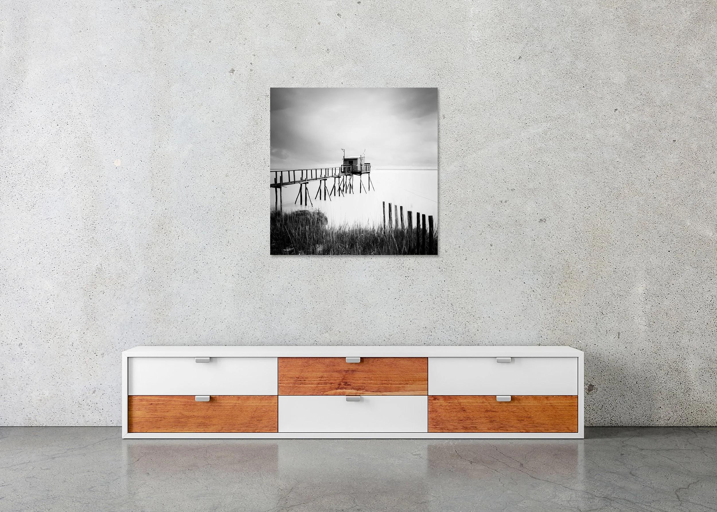 Stilt House no. 80915 displayed in a modern interior as a frameless black-and-white artwork mounted on aluminium Dibond by Gerald Berghammer.