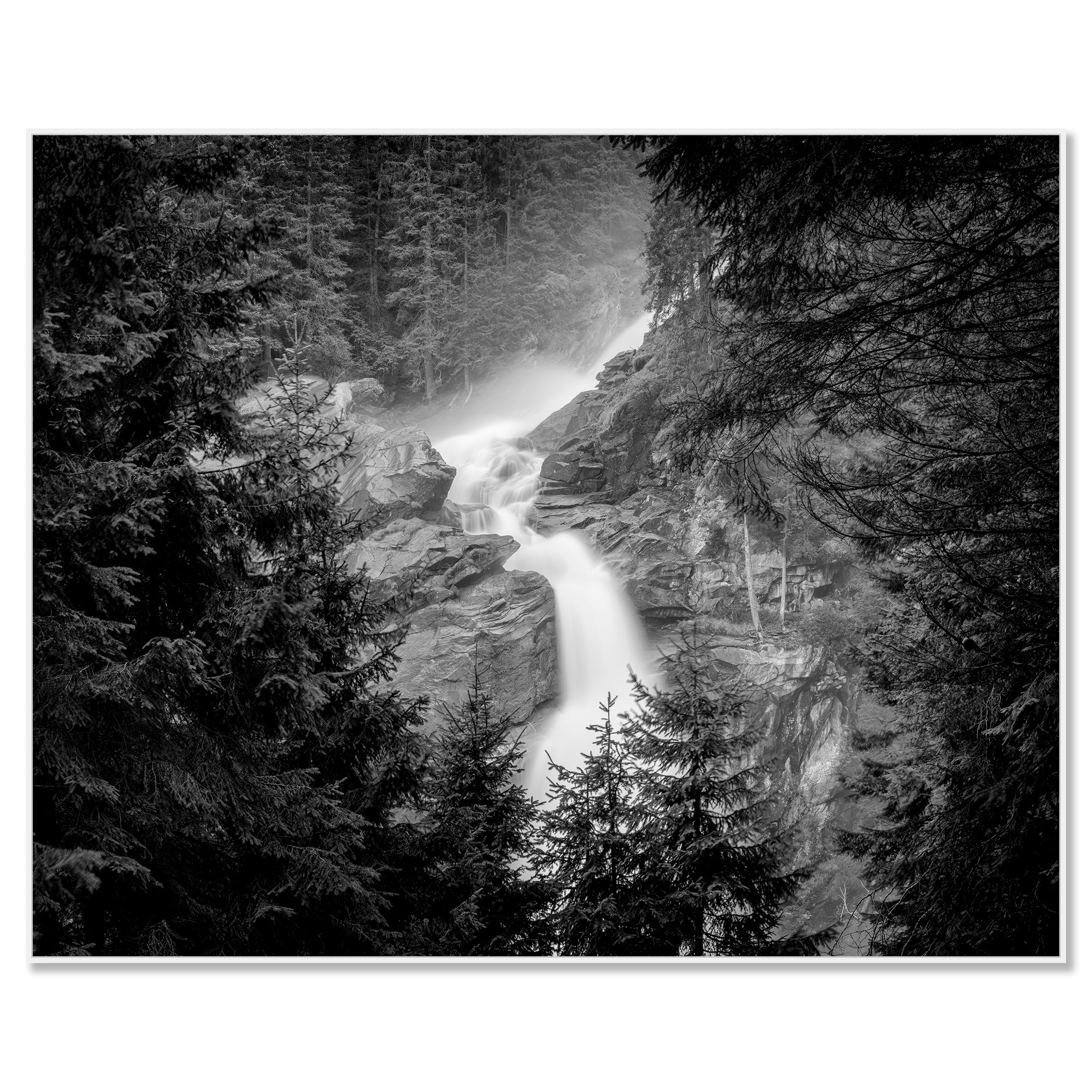 Krimml Waterfalls in monochrome, flowing through rocky forest scenery in Austria – framed ArtBox white