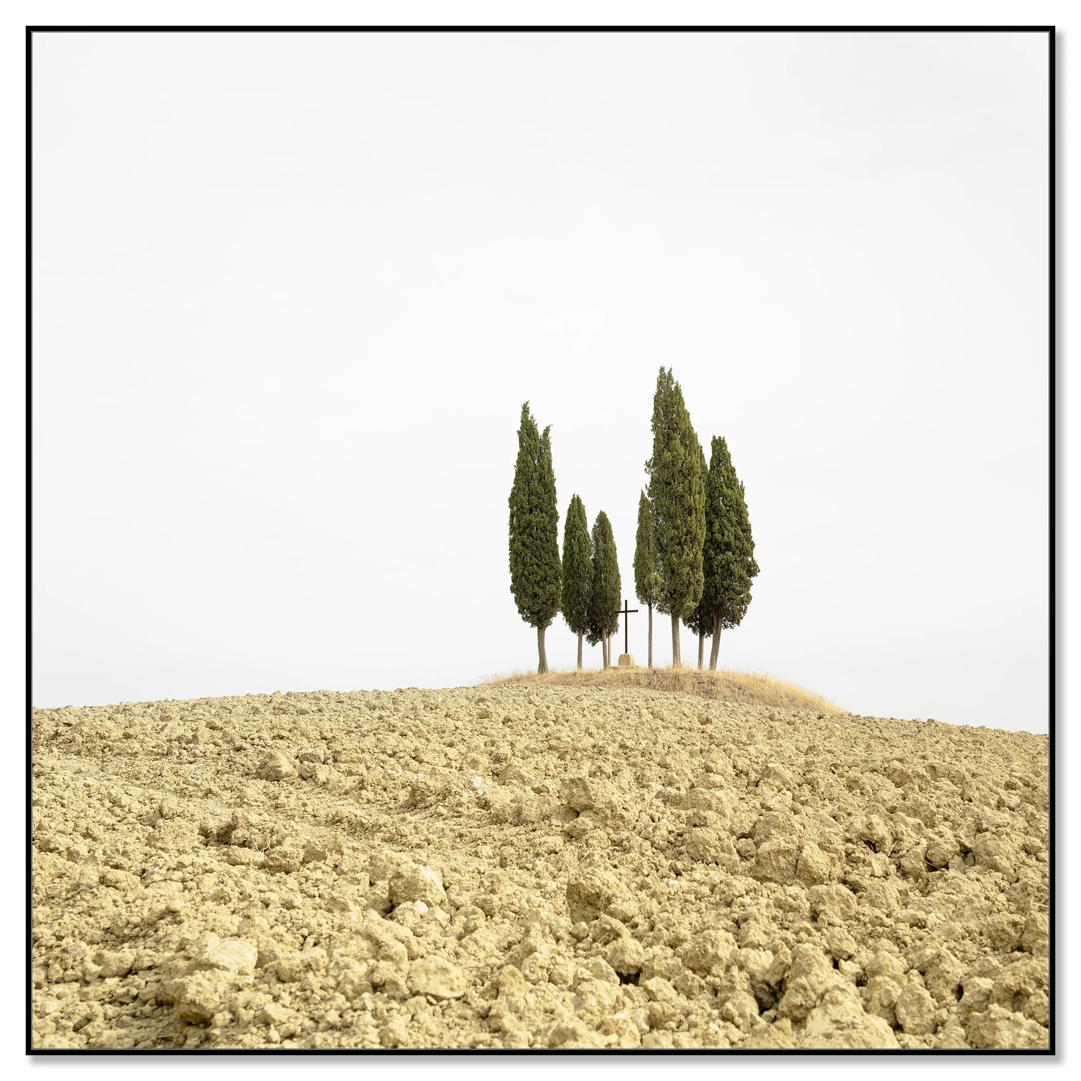 Cypress Tree on a Hill with a Cross, Tuscany, presented in a black aluminium ArtBox frame by Gerald Berghammer.