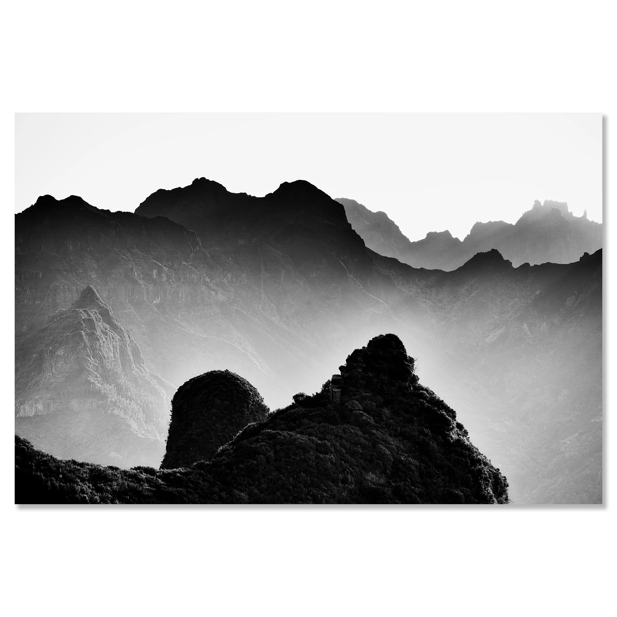 Black and white mountain landscape with layered rocky peaks and soft mist in the background – dibond frameless