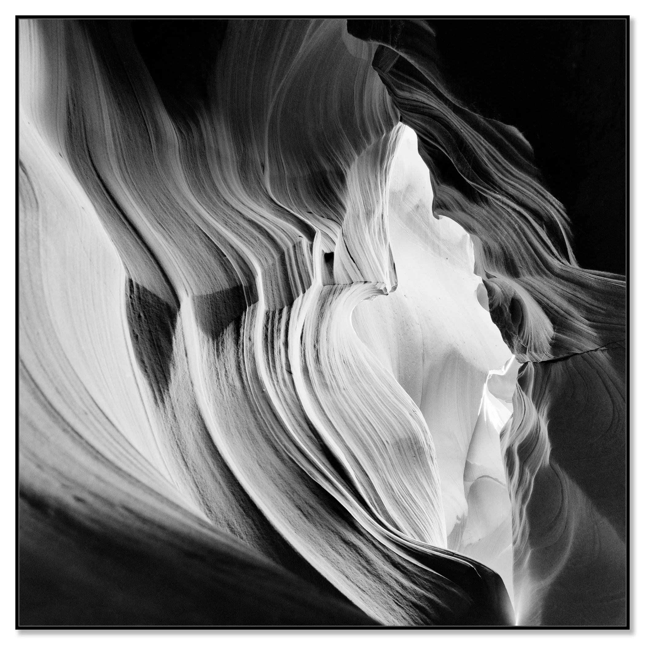 Abstract monochrome view of Antelope Canyon with layered sandstone textures and soft desert light – framed ArtBox black