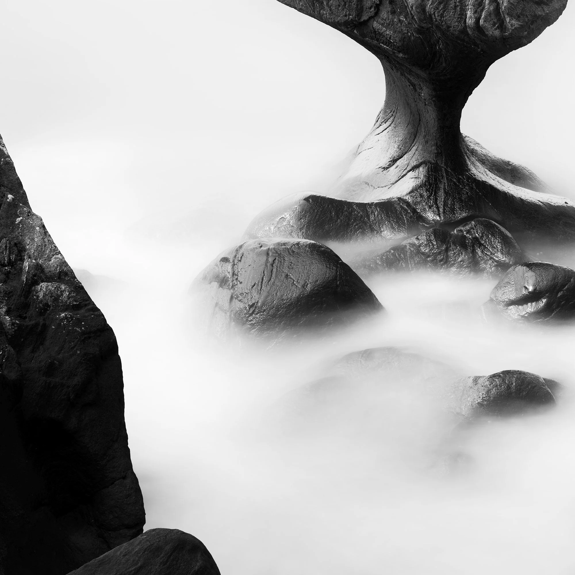 Detail of Attracted by the Sea Study 2 showing coastal rocks and mist-like long-exposure water in Norway by Gerald Berghammer.