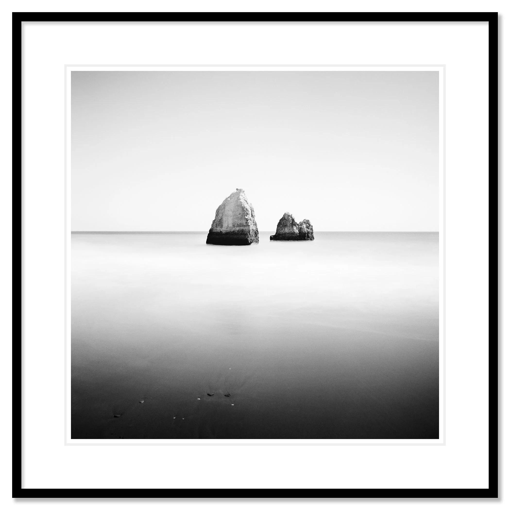 Gerald Berghammer - Long Exposure Seascape Photography. Two large rocks in calm ocean water, black and white photo with minimalistic composition. Classic framed black