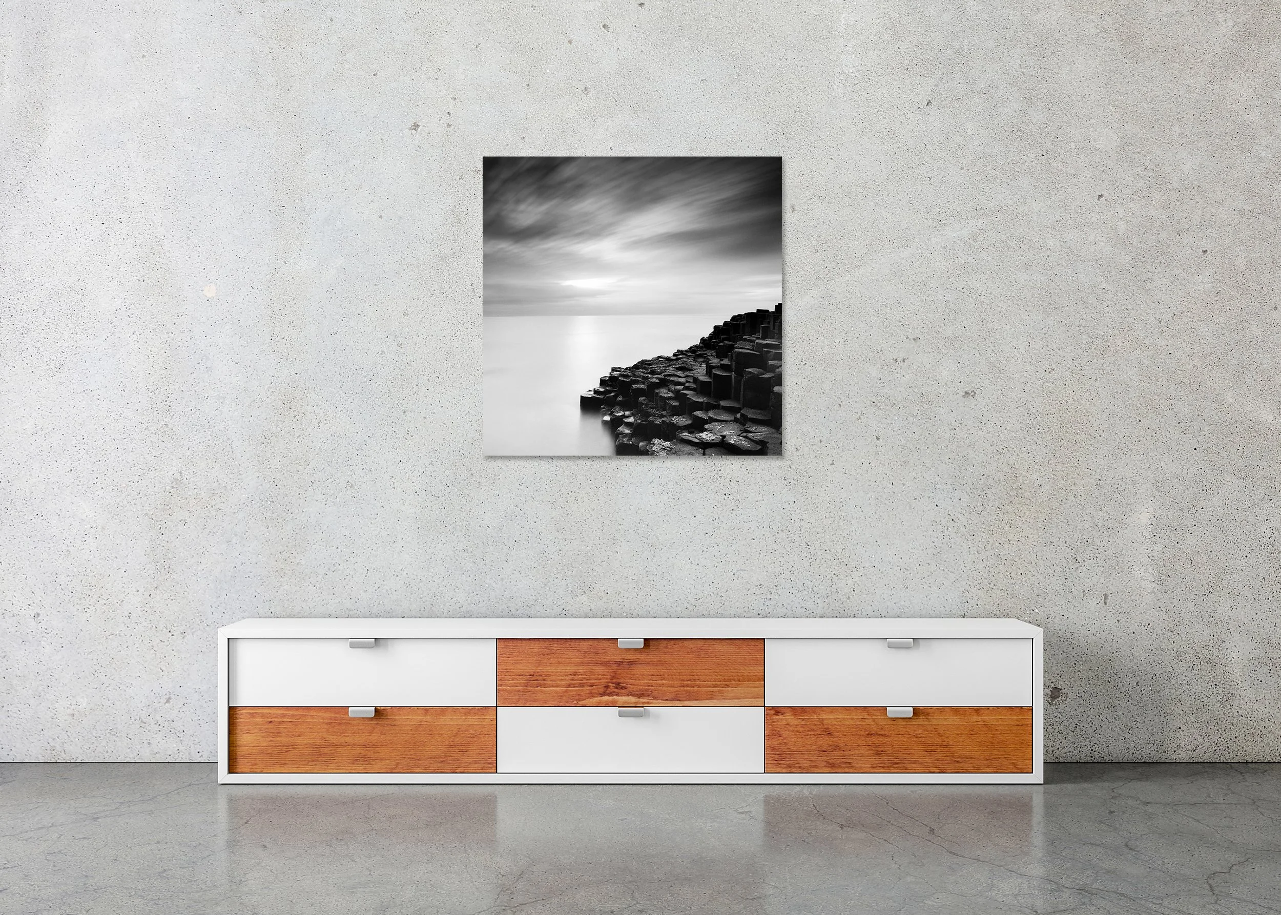 Giant’s Causeway Study 3 by Gerald Berghammer, frameless black-and-white photograph on aluminium Dibond displayed above a sideboard in a minimalist interior.