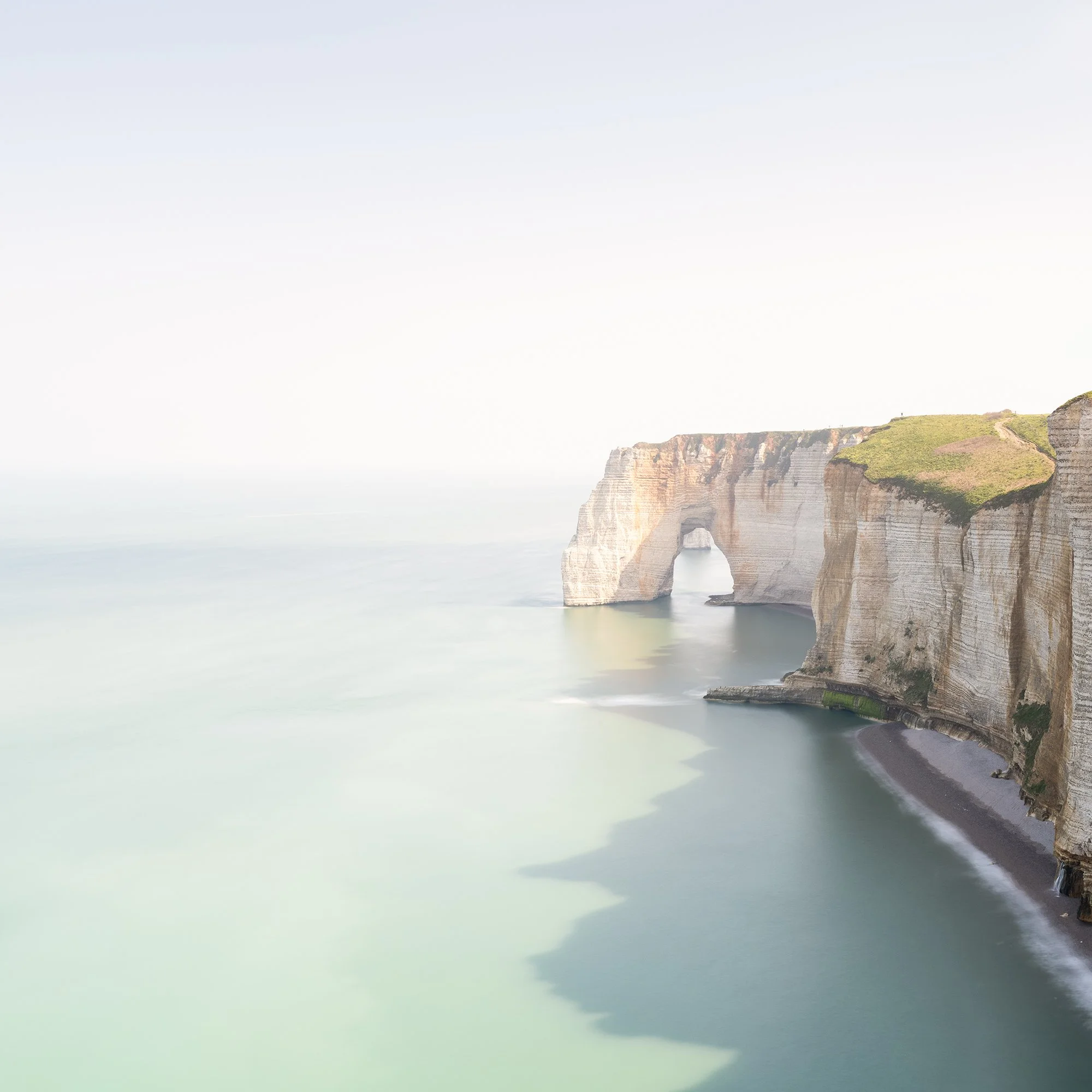 Detail of White Cliffs Panorama Study 2 by Gerald Berghammer showing the natural sea arch and long-exposure water at Étretat, France.