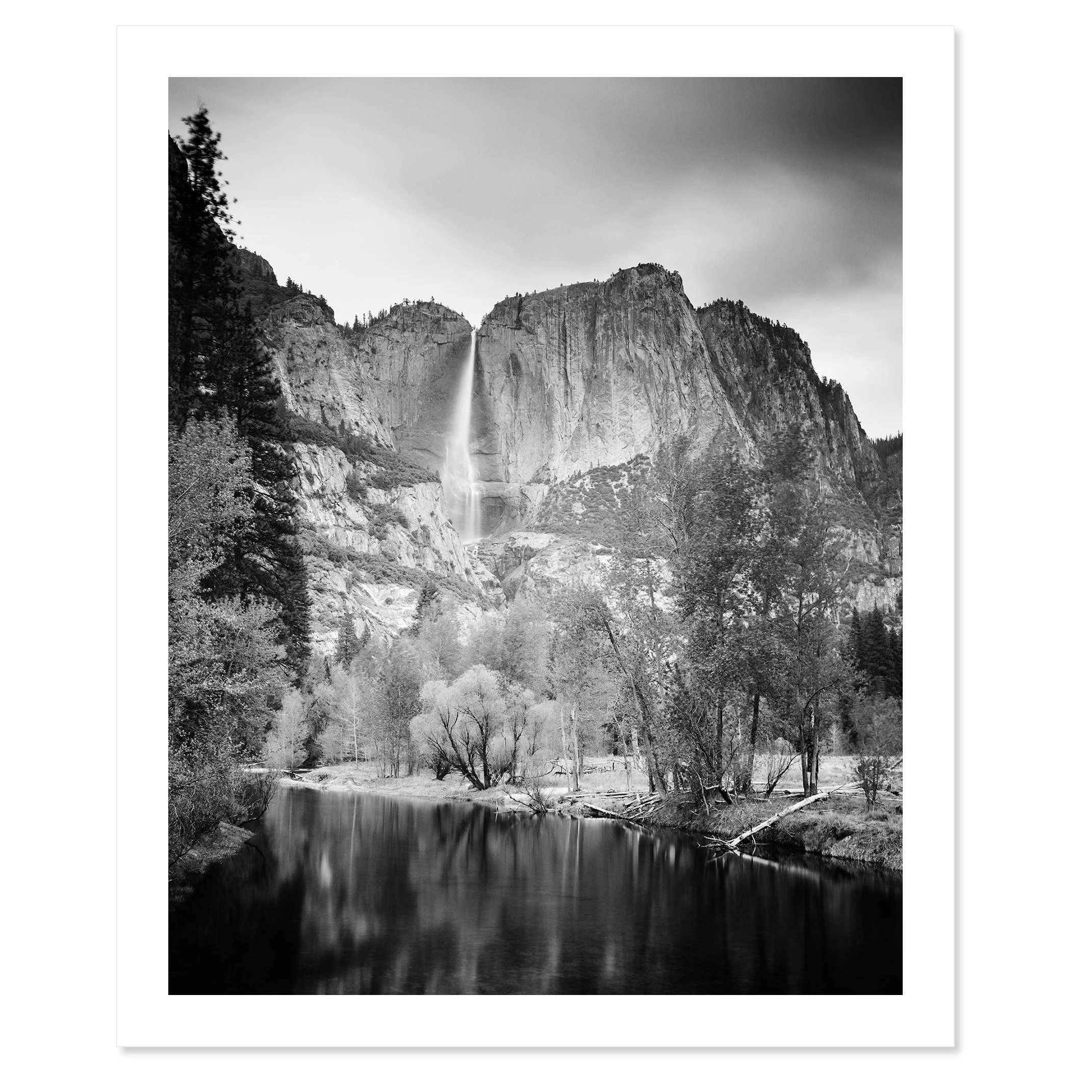 © 2015 Gerald Berghammer - Black and white american landscaspe photography. Mountain landscape with a waterfall, trees, and a calm river in the foreground. Fine art print only