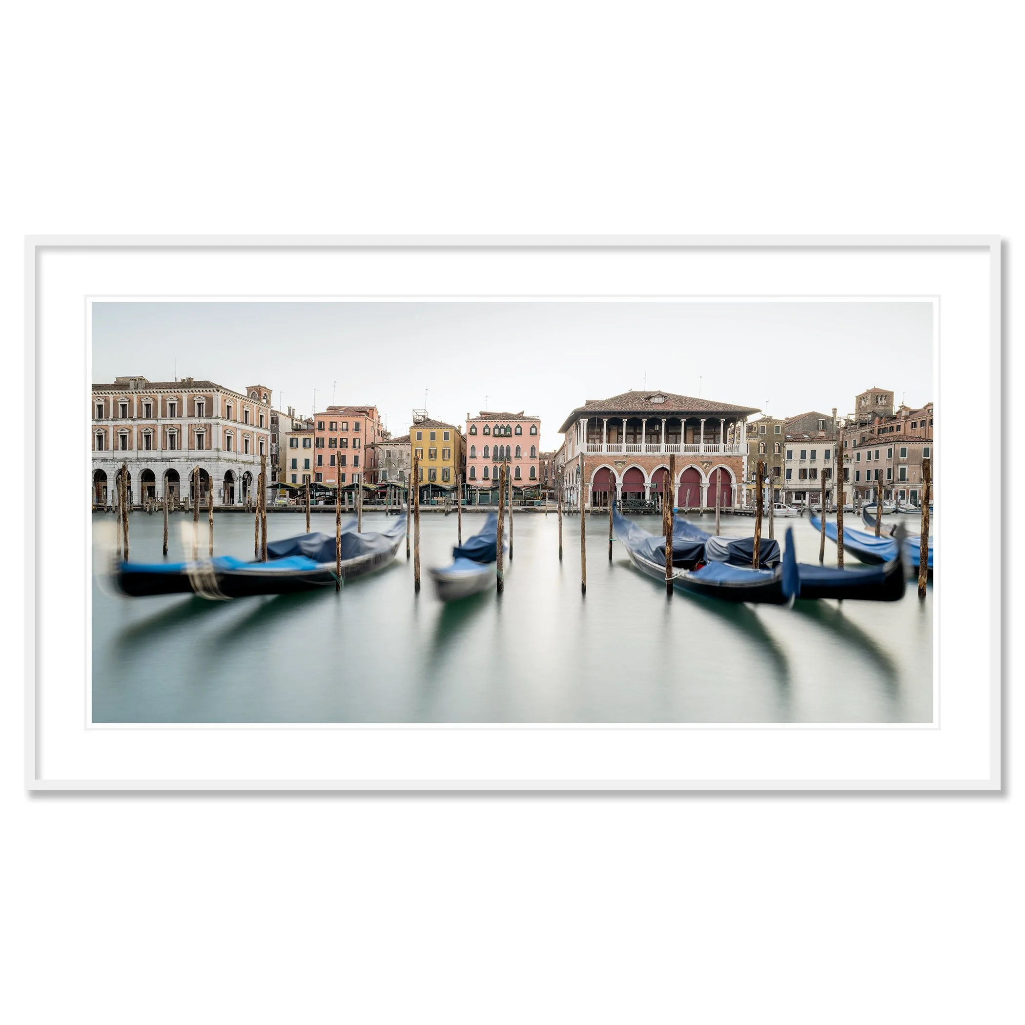 © 2025 Gerald Berghammer - Color cityscape photography. Gondolas docked along a canal in Venice, Italy, with historic buildings and the fish market in the back. Classic framed white