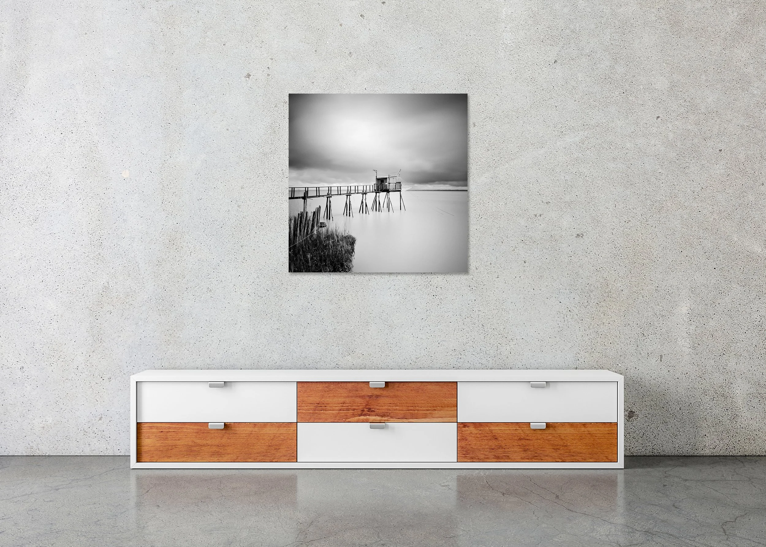 Stilt House PK 53880 displayed in a modern interior as a frameless black-and-white artwork mounted on aluminium Dibond by Gerald Berghammer.